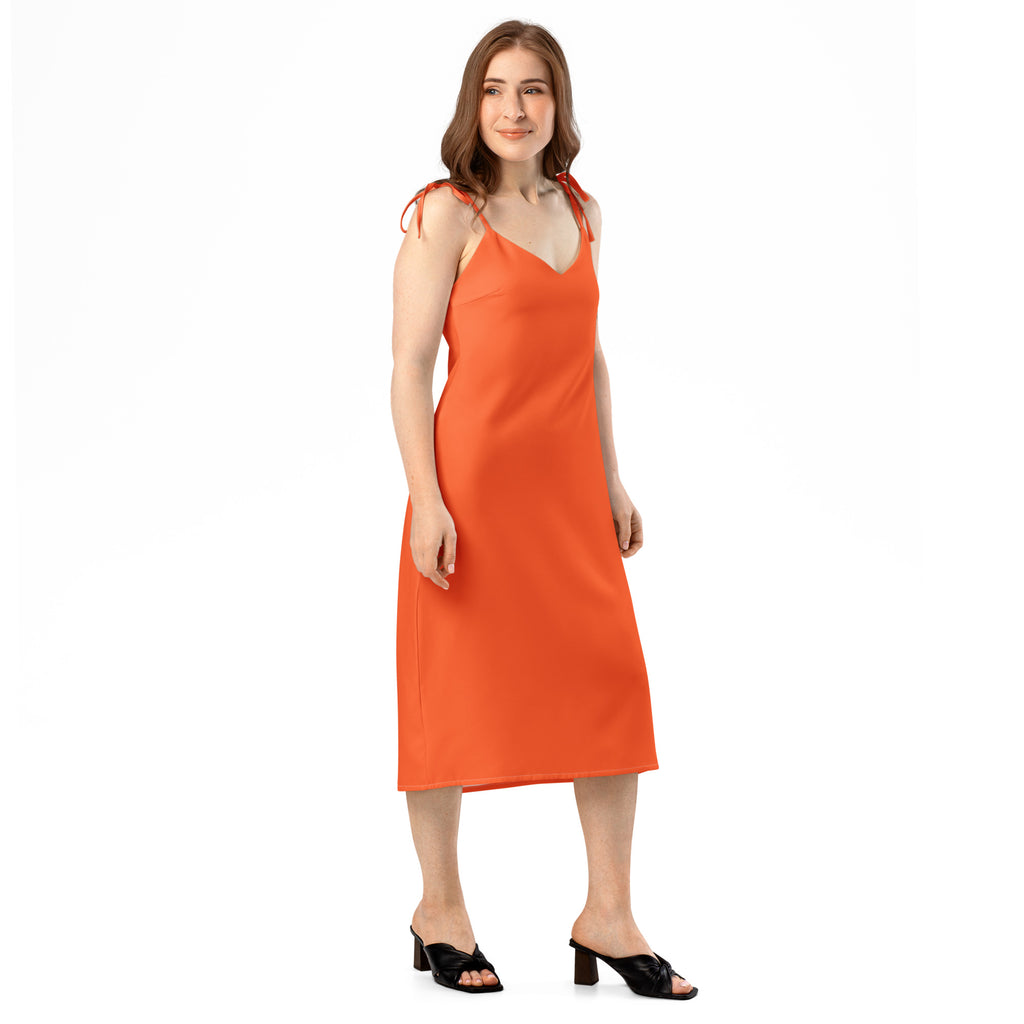 Woman wearing an orange dress on a white background
