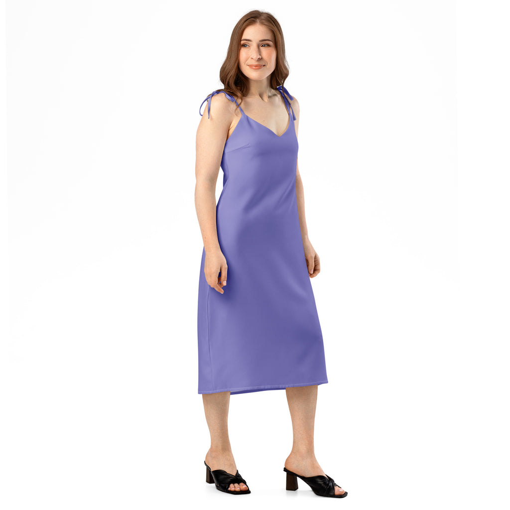 Woman wearing a purple dress on a white background