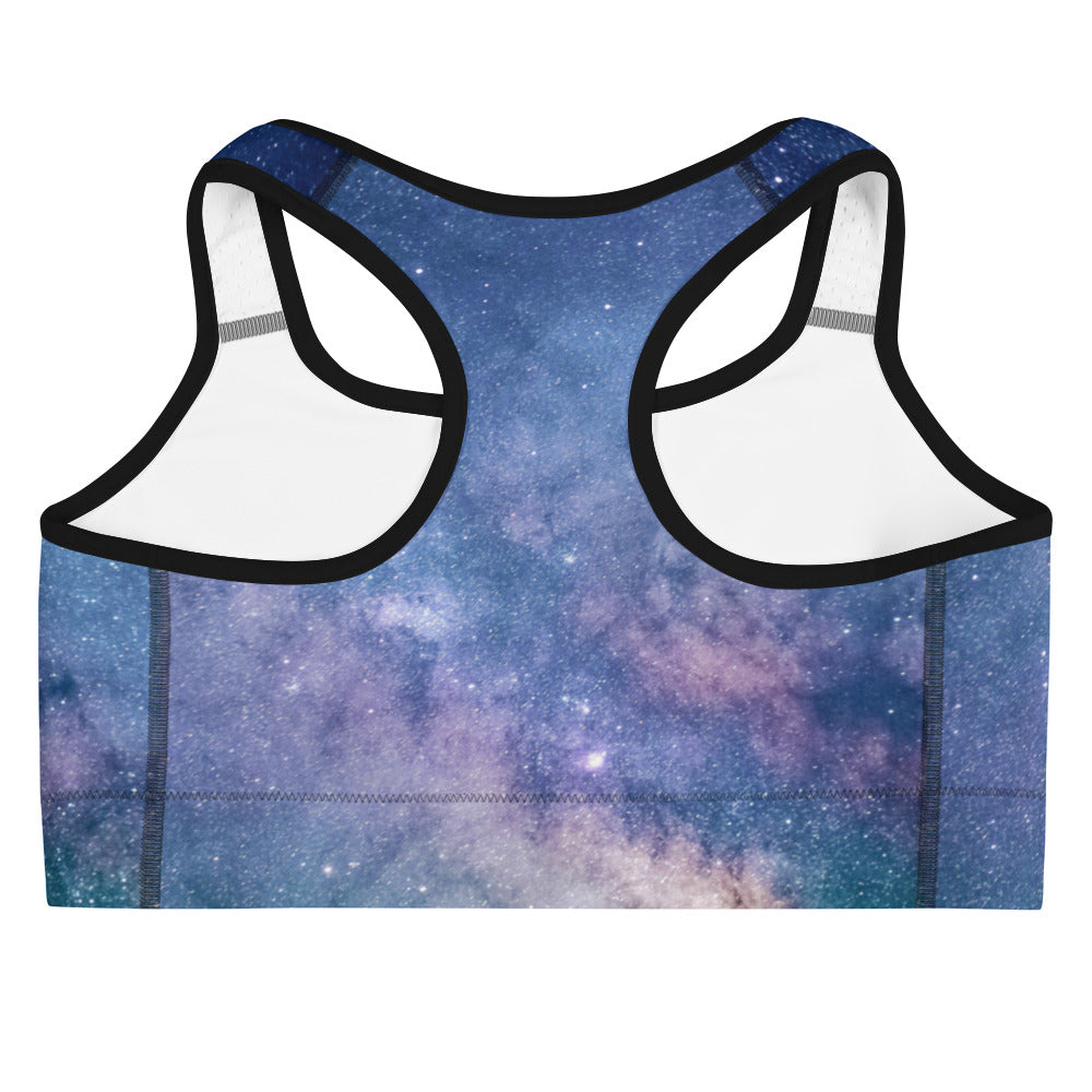 Women’s realistic galaxy quick drying sports bra with vibrant blue and purple starry print white panels and black trim