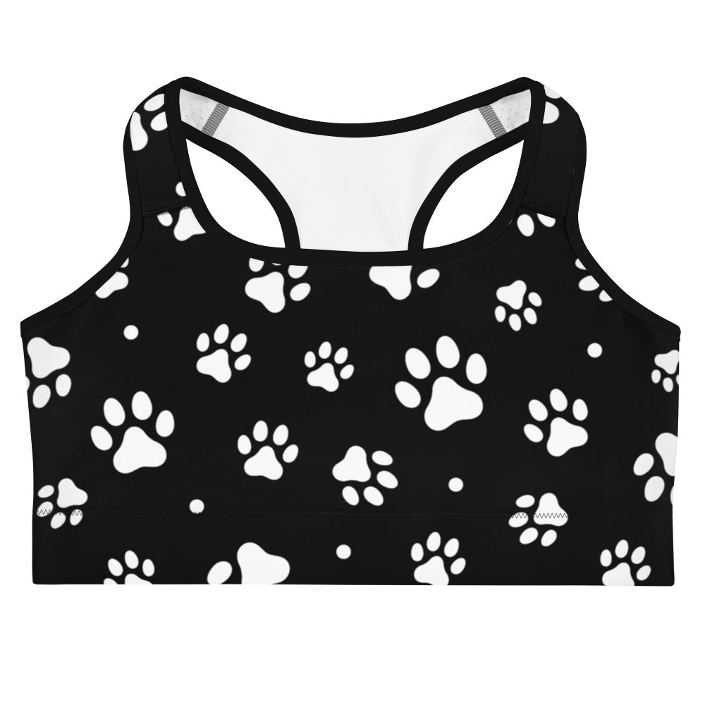Black quick drying sports bra with white paw print pattern designed for women’s activewear sessions