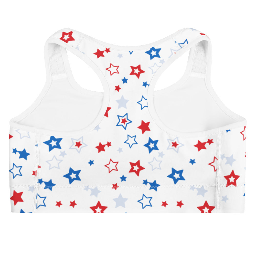 White quick drying sports bra with playful red blue and gray star pattern for women