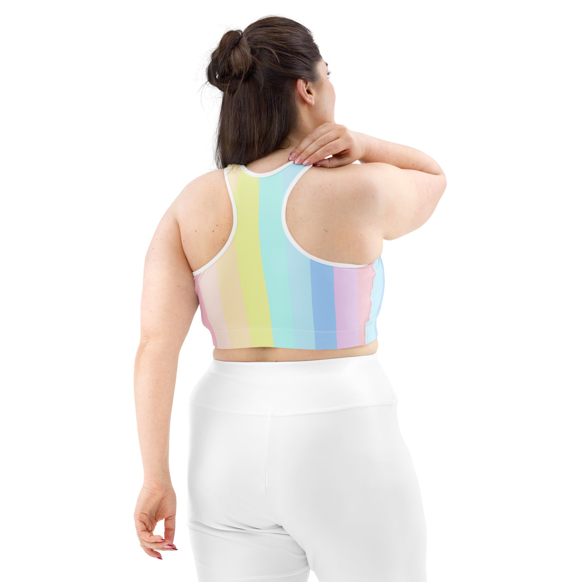 Women’s pastel rainbow stripe quick drying sports bra with white trim featuring a crop top design