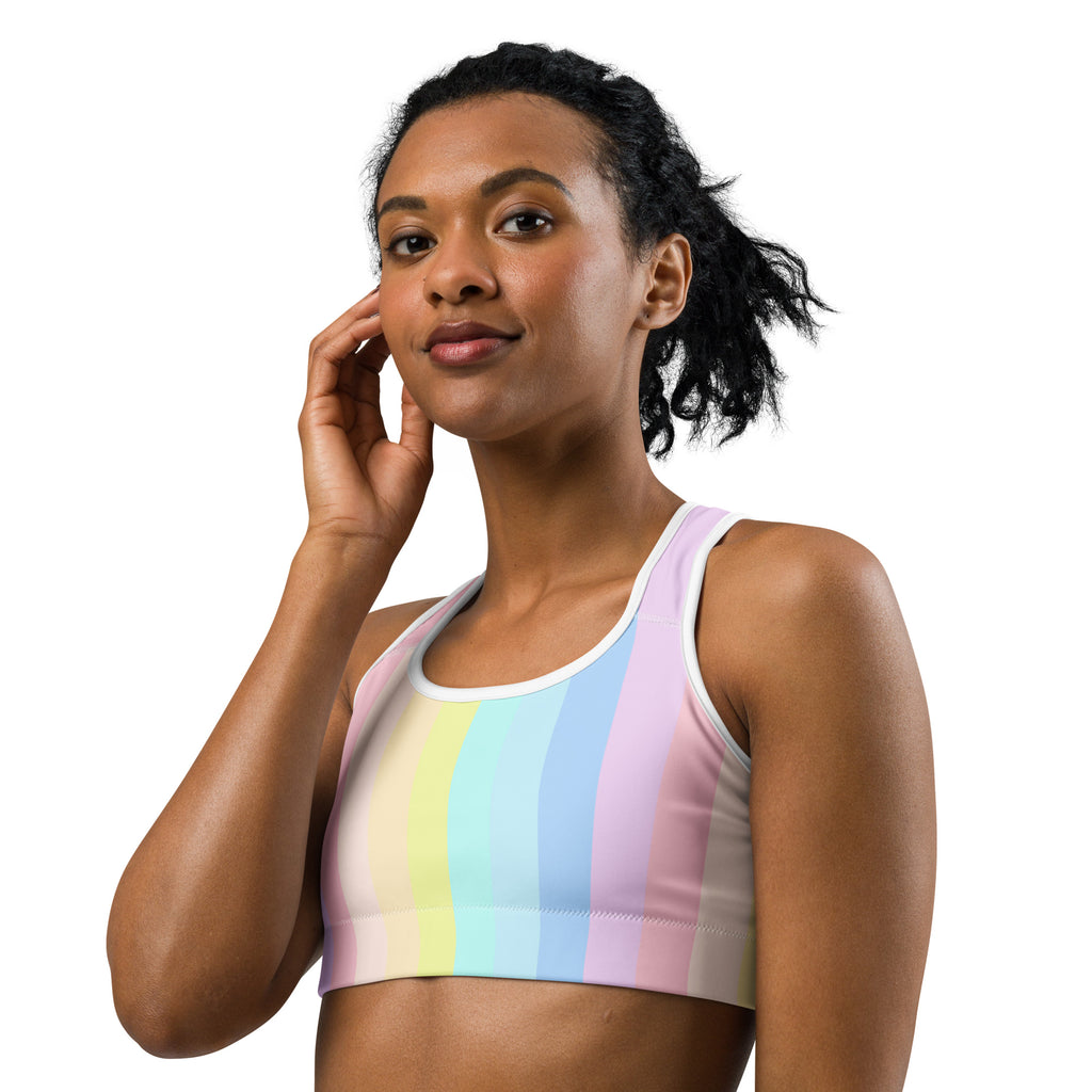 Women’s pastel rainbow stripe quick drying sports bra with white trim designed for active wear