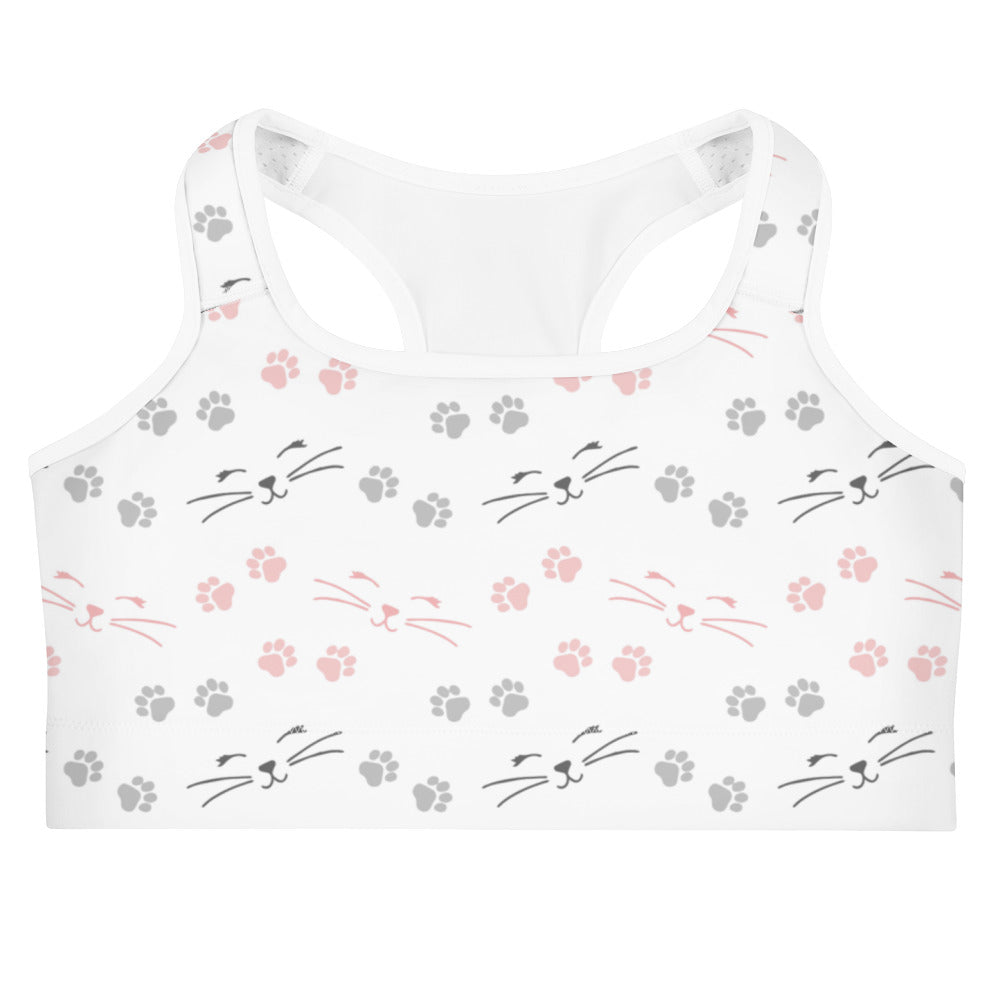 White quick drying sports bra with pink and gray cat faces and paw prints playful pattern for women