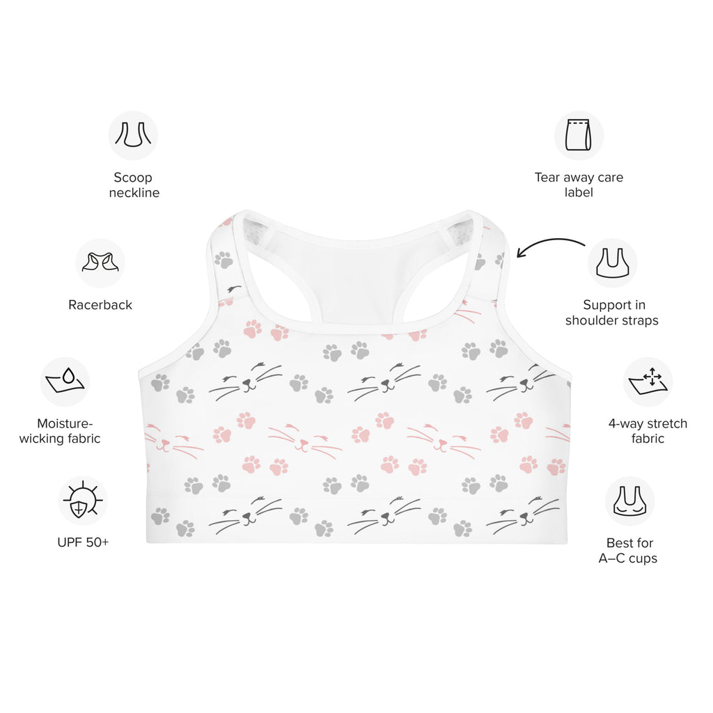 White racerback quick drying sports bra with playful pink and gray cat faces whiskers and paw prints pattern