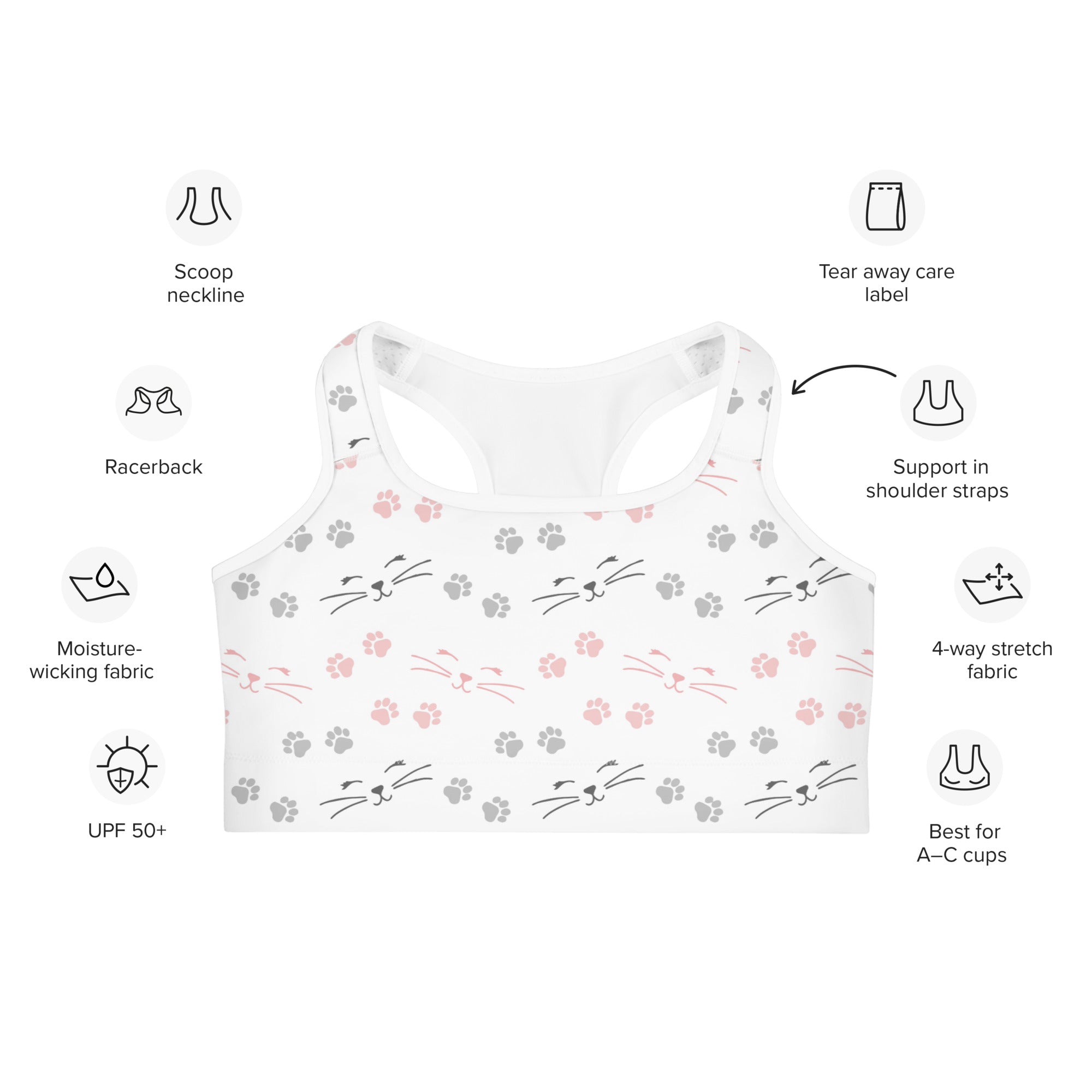 White racerback quick drying sports bra with playful pink and gray cat faces whiskers and paw prints pattern