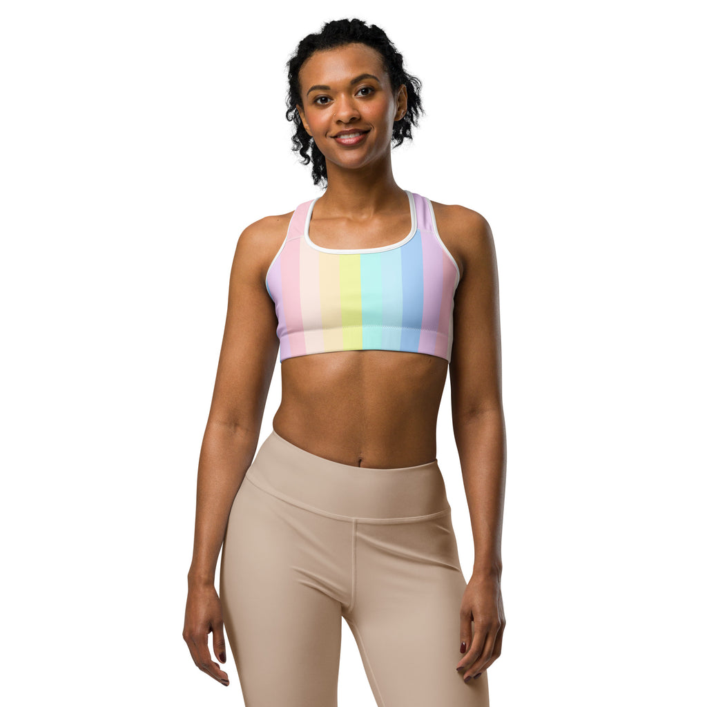 Women’s pastel rainbow stripe quick drying sports bra with white trim designed for active wear and comfort