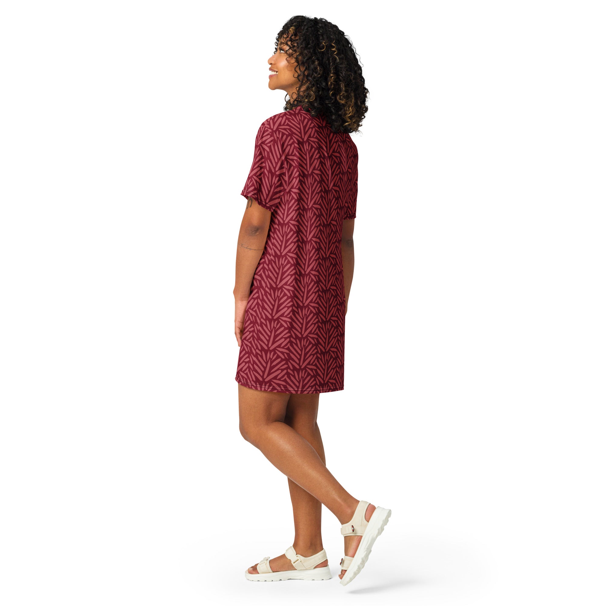 A women’s maroon t-shirt dress with a subtle white leaf pattern made of lightweight fabric