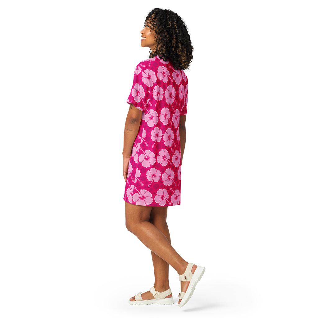 A vibrant pink women’s tropical t-shirt dress with short sleeves and light pink hibiscus flower print