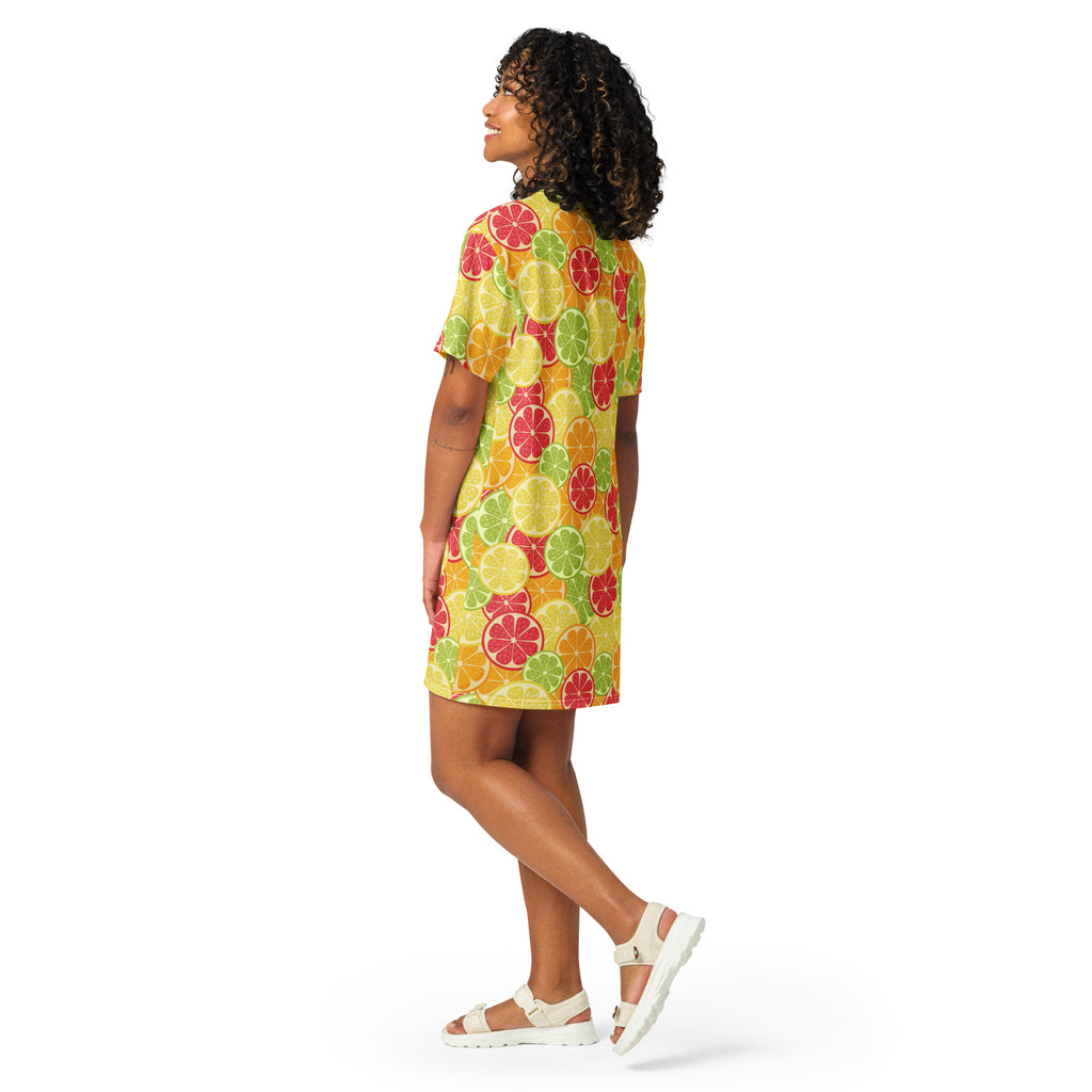 Women’s citrus fruit t-shirt dress in vibrant yellow with playful sliced citrus patterns in red green and orange hues
