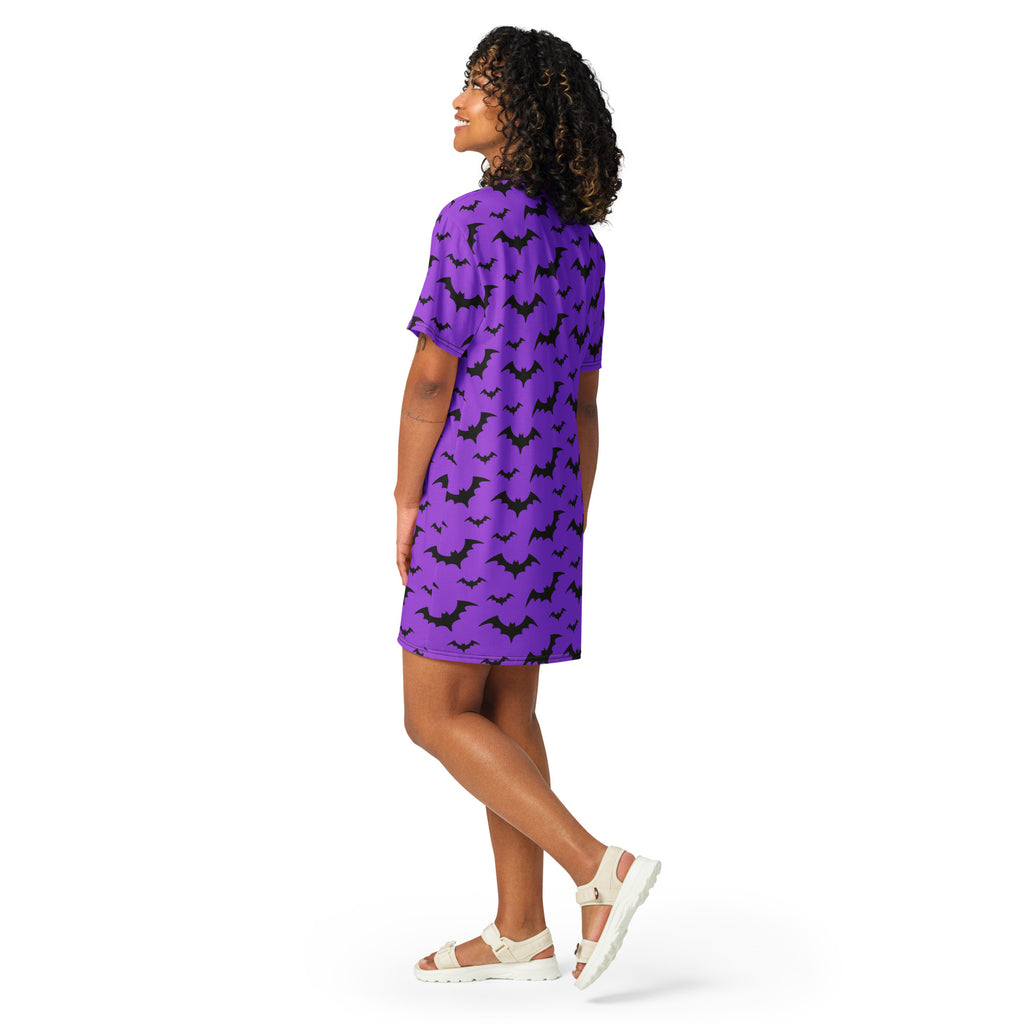 Women’s purple short-sleeved t-shirt dress with black bat pattern perfect for Halloween wear