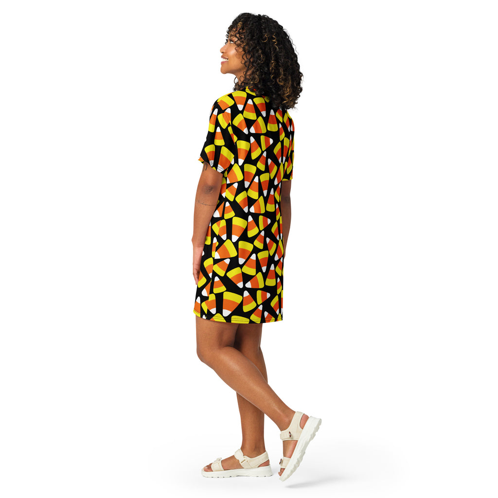 Women’s black short-sleeved t-shirt dress with vibrant yellow orange and white candy corn pattern for Halloween
