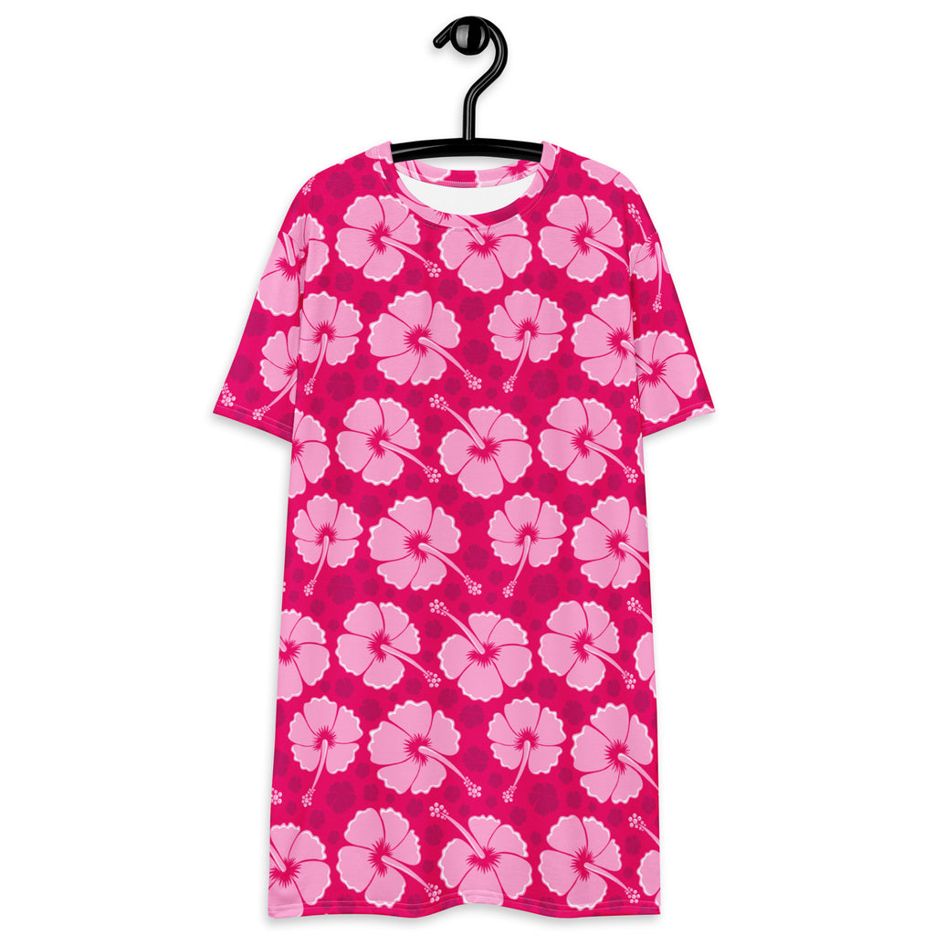 A vibrant pink tropical hibiscus print short-sleeved women’s t-shirt dress hanging on a black plastic hanger