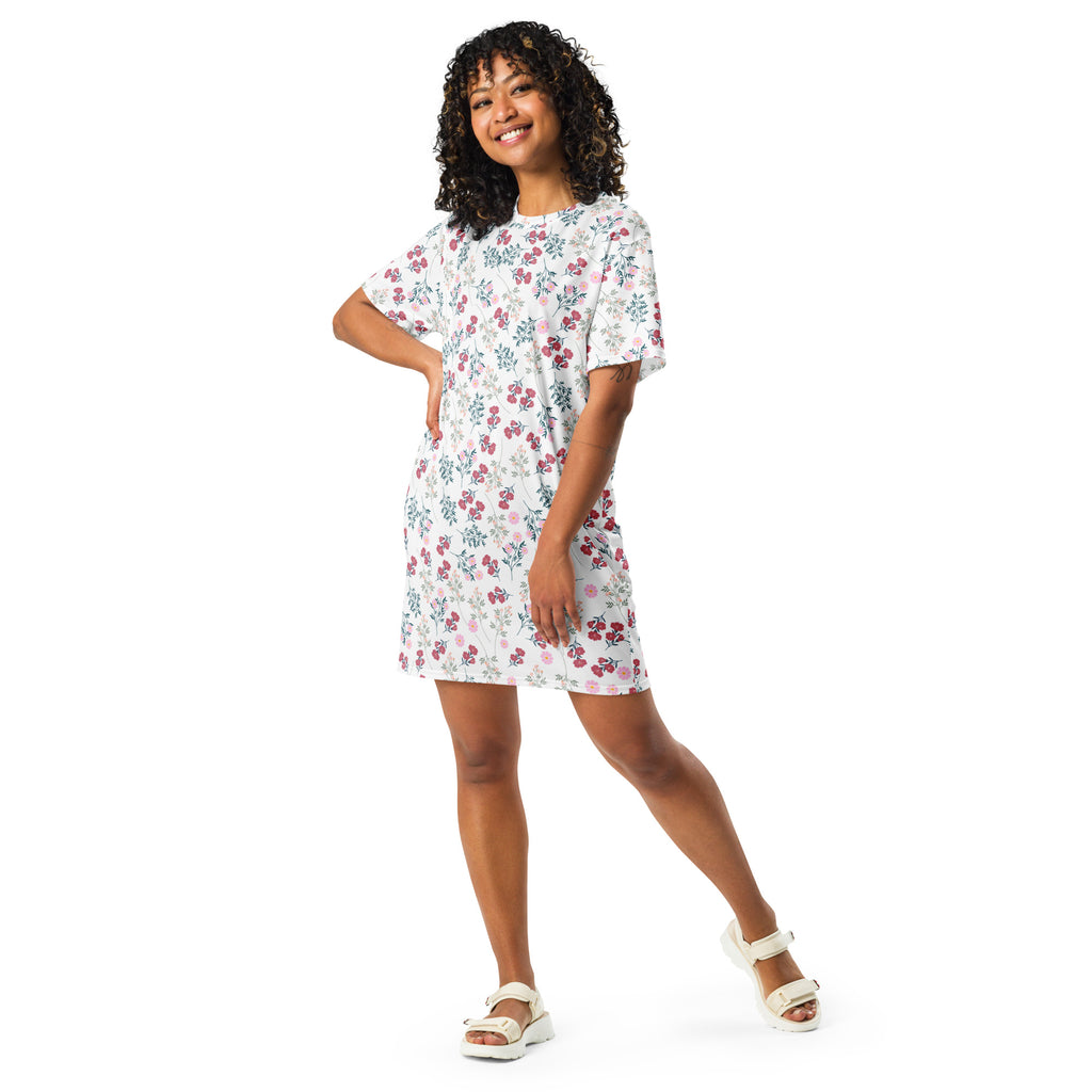 Women’s white floral t-shirt dress with short sleeves and pink and green blossoms on lightweight fabric