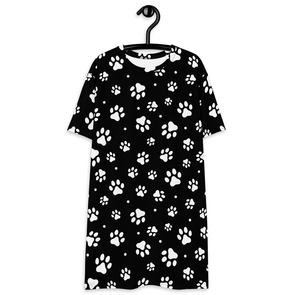 Black short-sleeved women’s t-shirt dress with white paw print pattern made from soft comfortable fabric