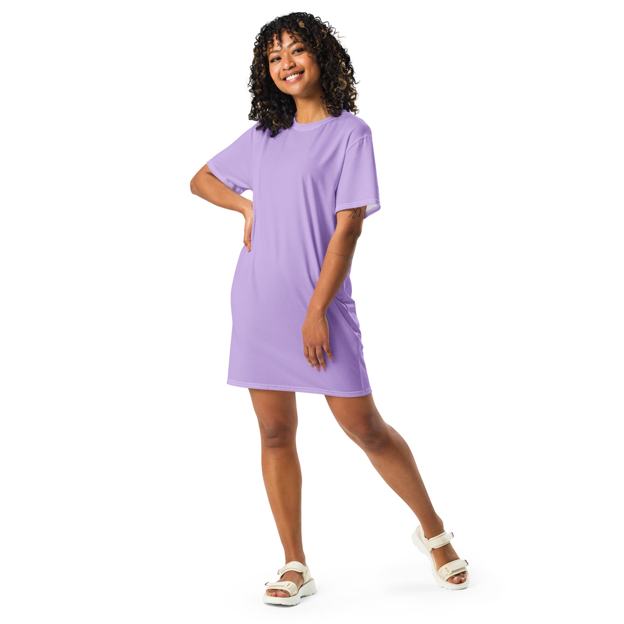 A soft lavender loose-fitting t-shirt dress with a simple crew neckline and short sleeves for women