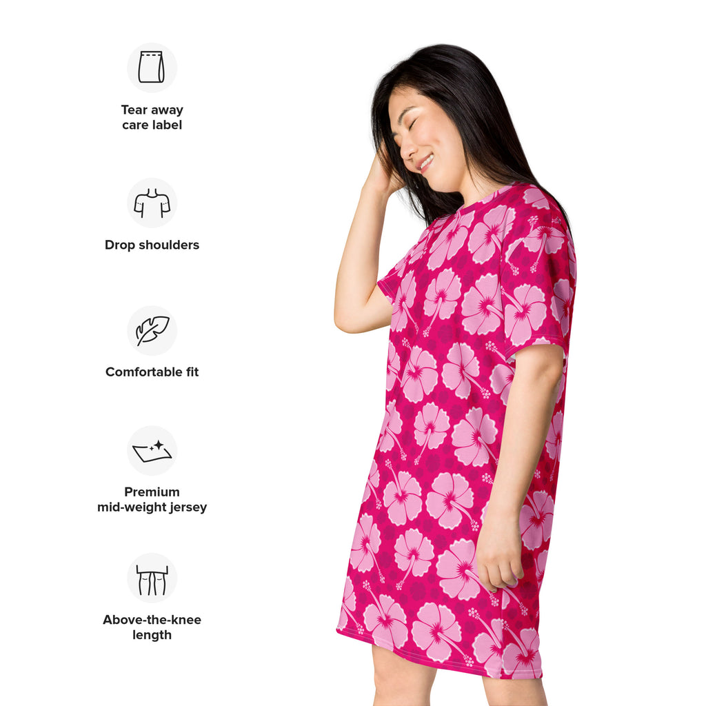 A vibrant pink women’s tropical hibiscus t-shirt dress with light pink flowers made from premium mid-weight jersey fabric