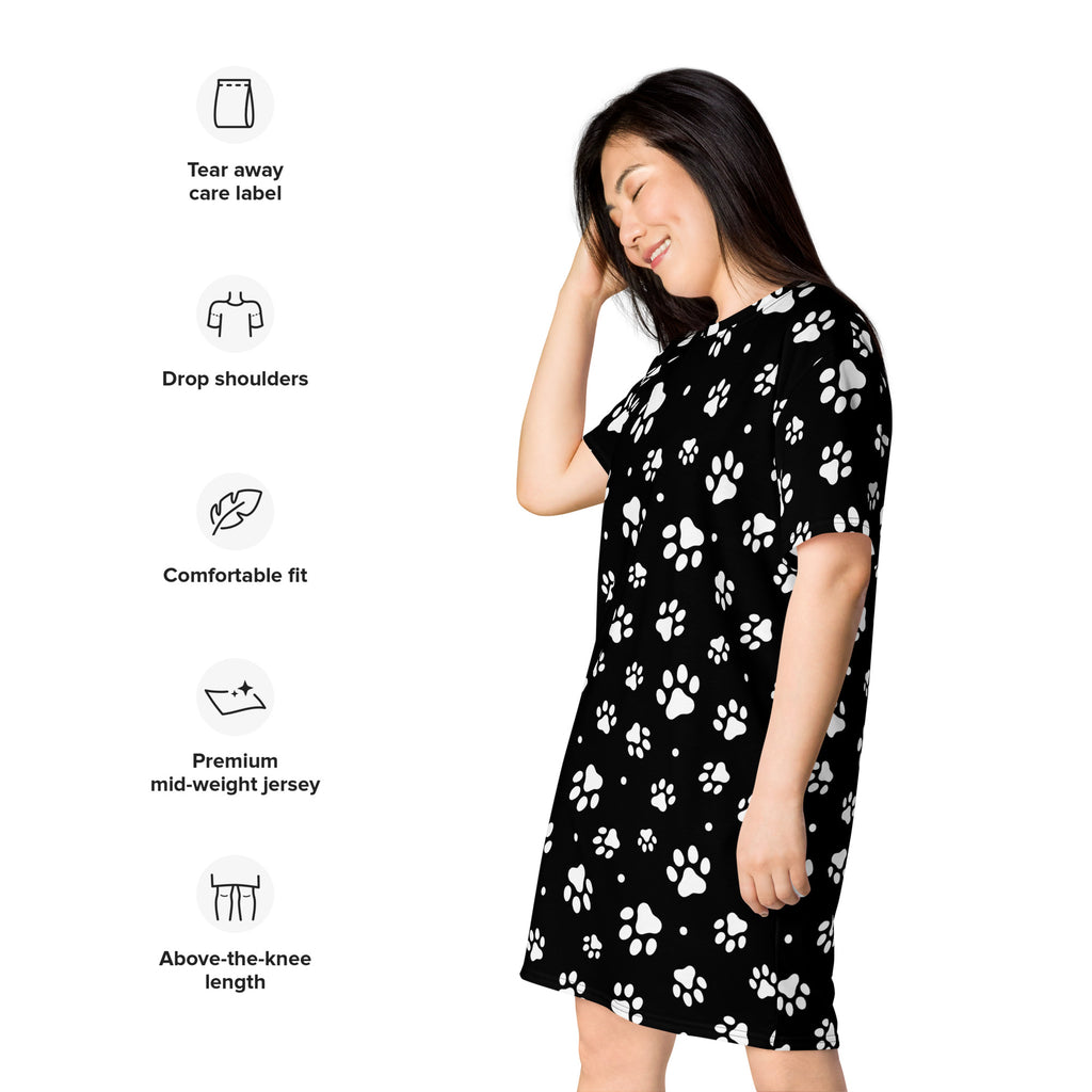 Black short-sleeved women’s paw print t-shirt dress made of premium mid-weight jersey fabric with white pattern