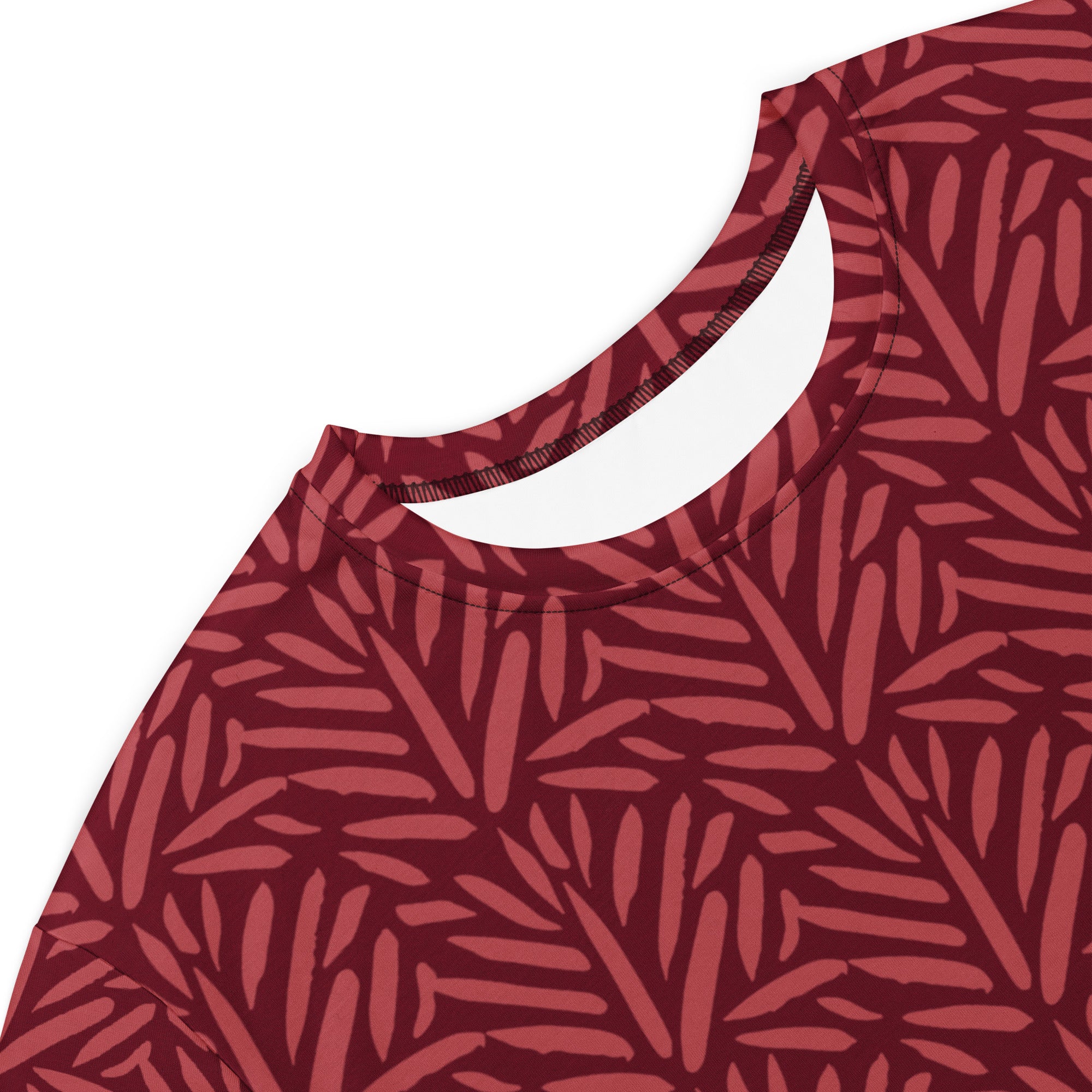 Women’s maroon t-shirt dress with leafy pattern in lighter red tones and rounded neckline with ribbed trim