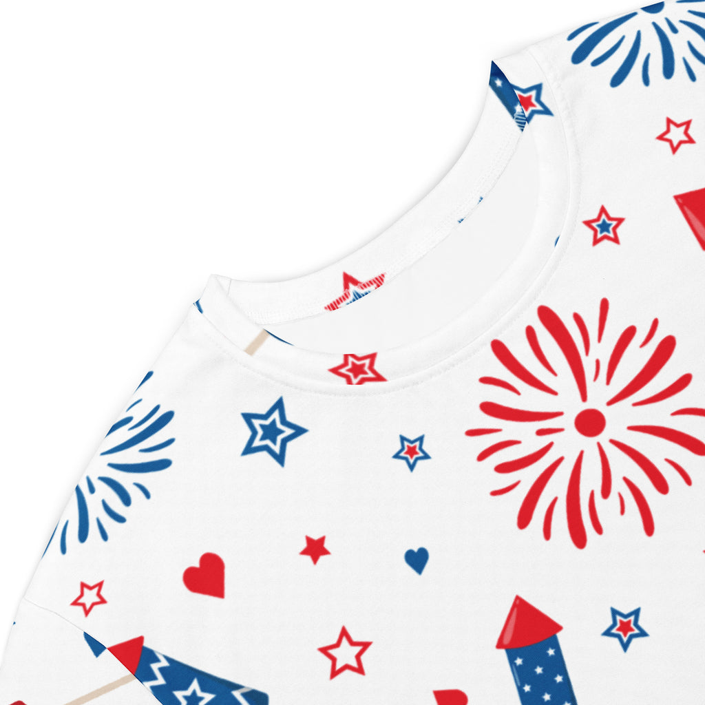 White cotton women’s t-shirt dress with a festive red and blue fireworks stars hearts and rockets pattern