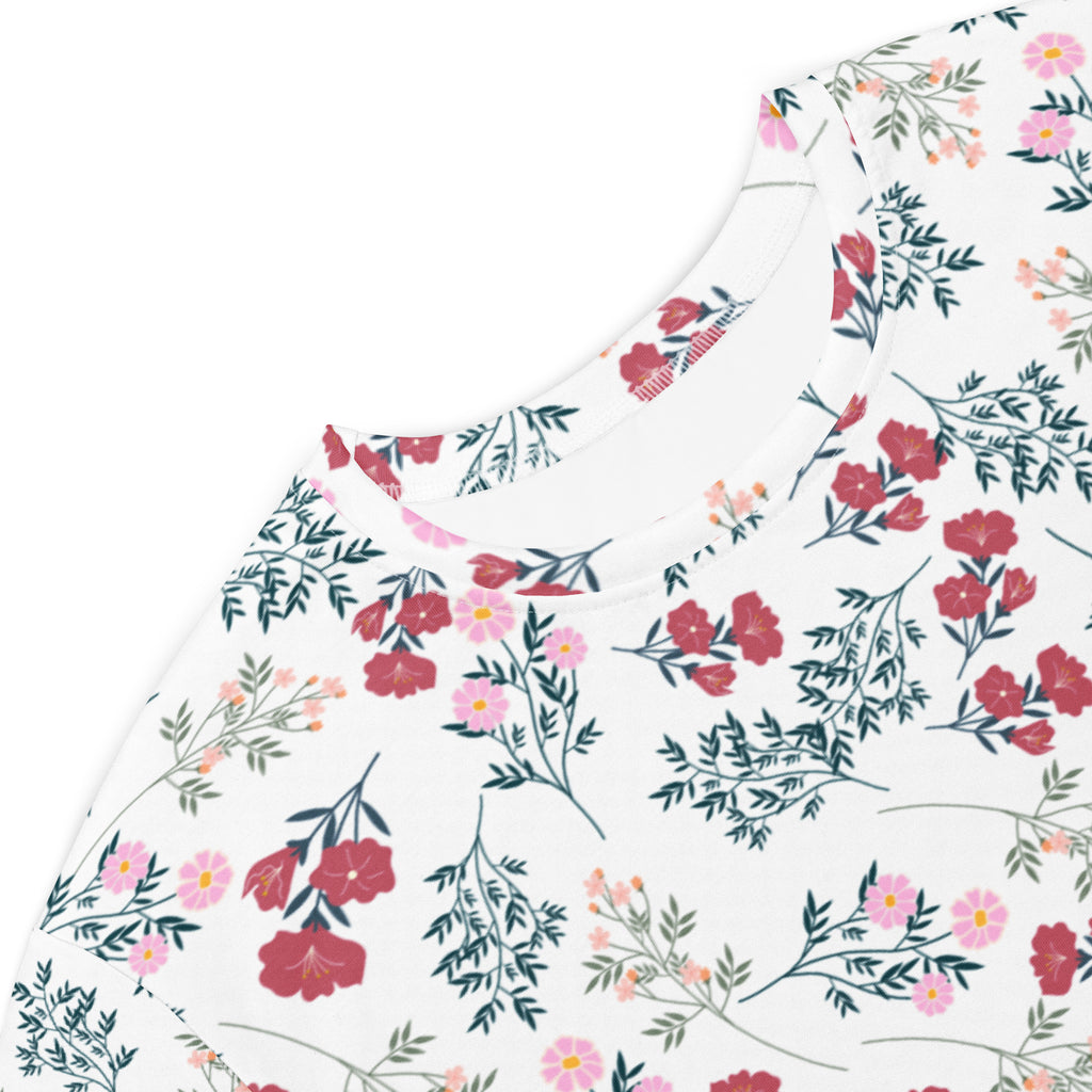 Women’s white floral t-shirt dress with red and pink flowers and green stems on a white cotton fabric