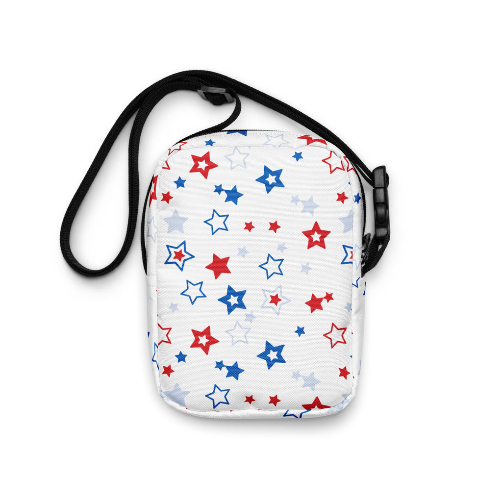 Girls red white and blue stars crossbody purse in white with a playful pattern of red blue and light gray stars