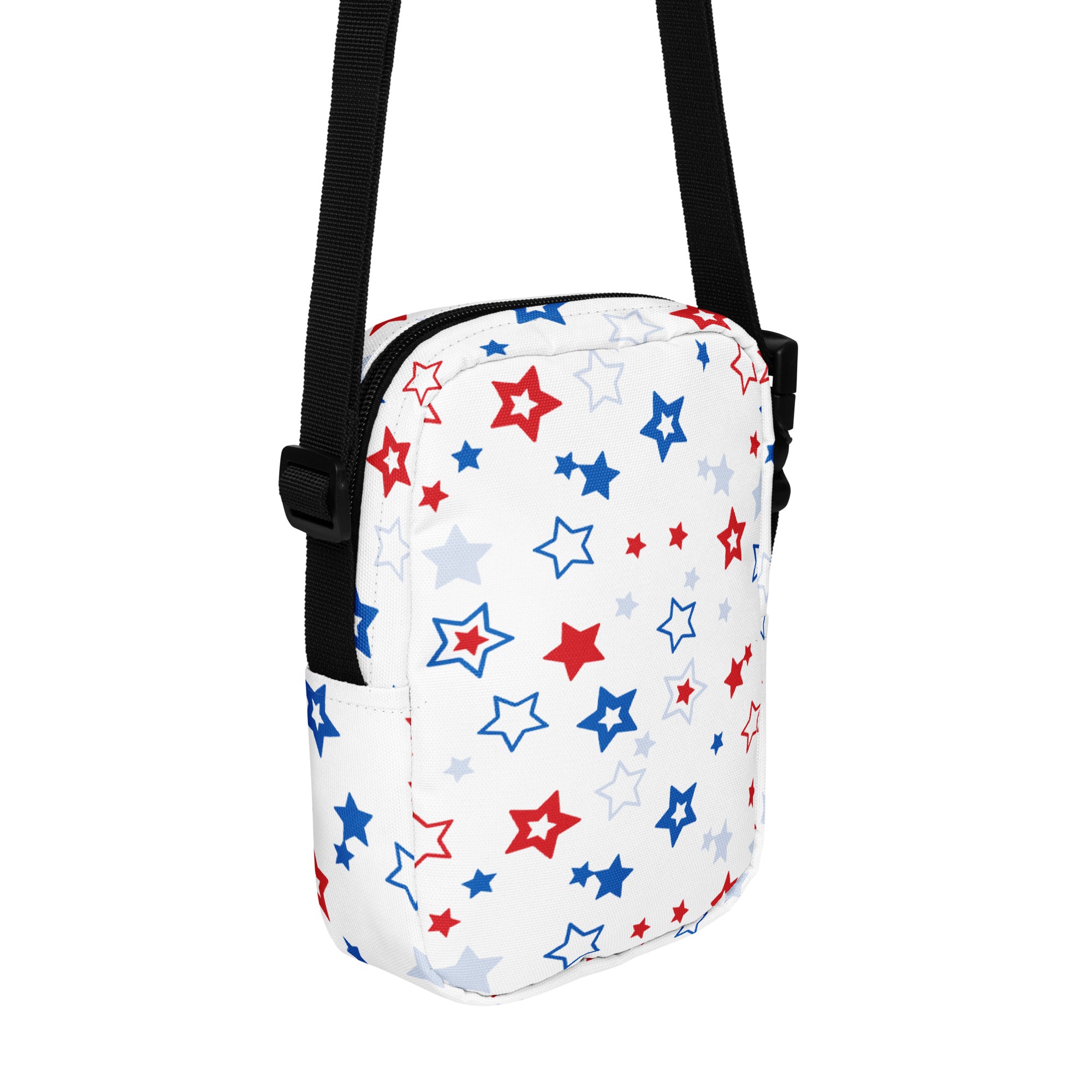 White crossbody bag with a playful red blue and gray star pattern for girls featuring a fabric surface