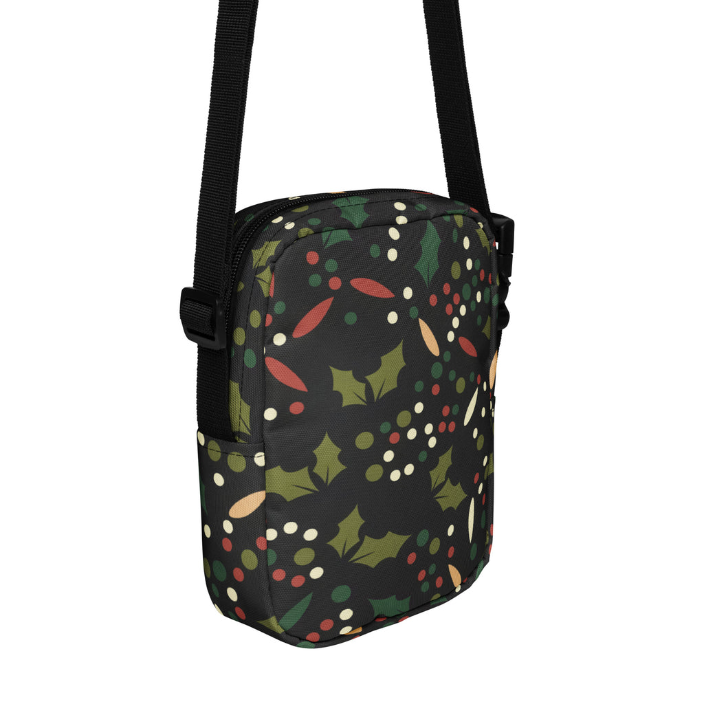Black girls crossbody purse with festive green holly leaves red and white berries pattern for Christmas use