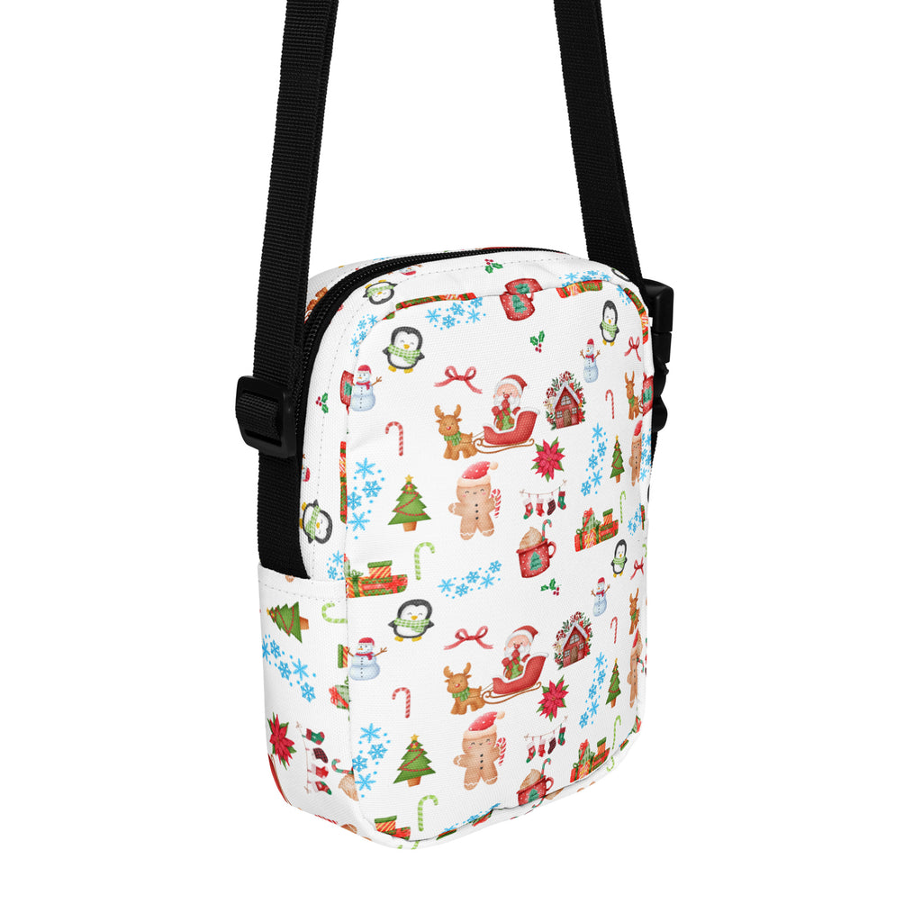 White fabric christmas women’s crossbody purse with festive print of penguins santa claus reindeer gingerbread men and candy canes