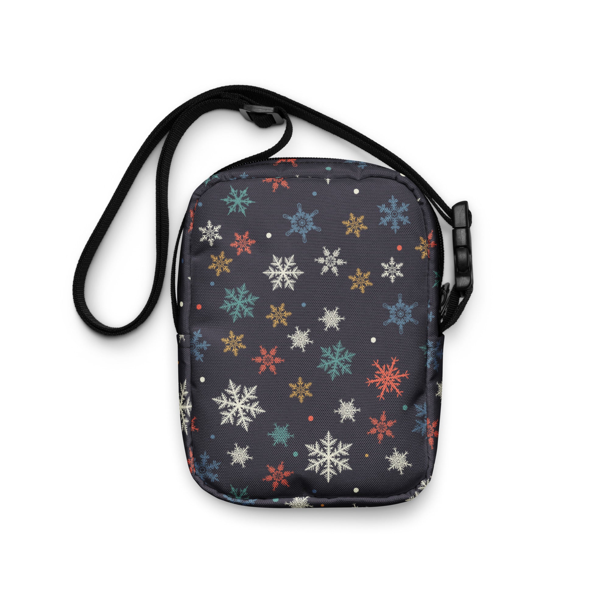 A black crossbody purse with vibrant multicolored snowflake patterns in white red blue and gold for women