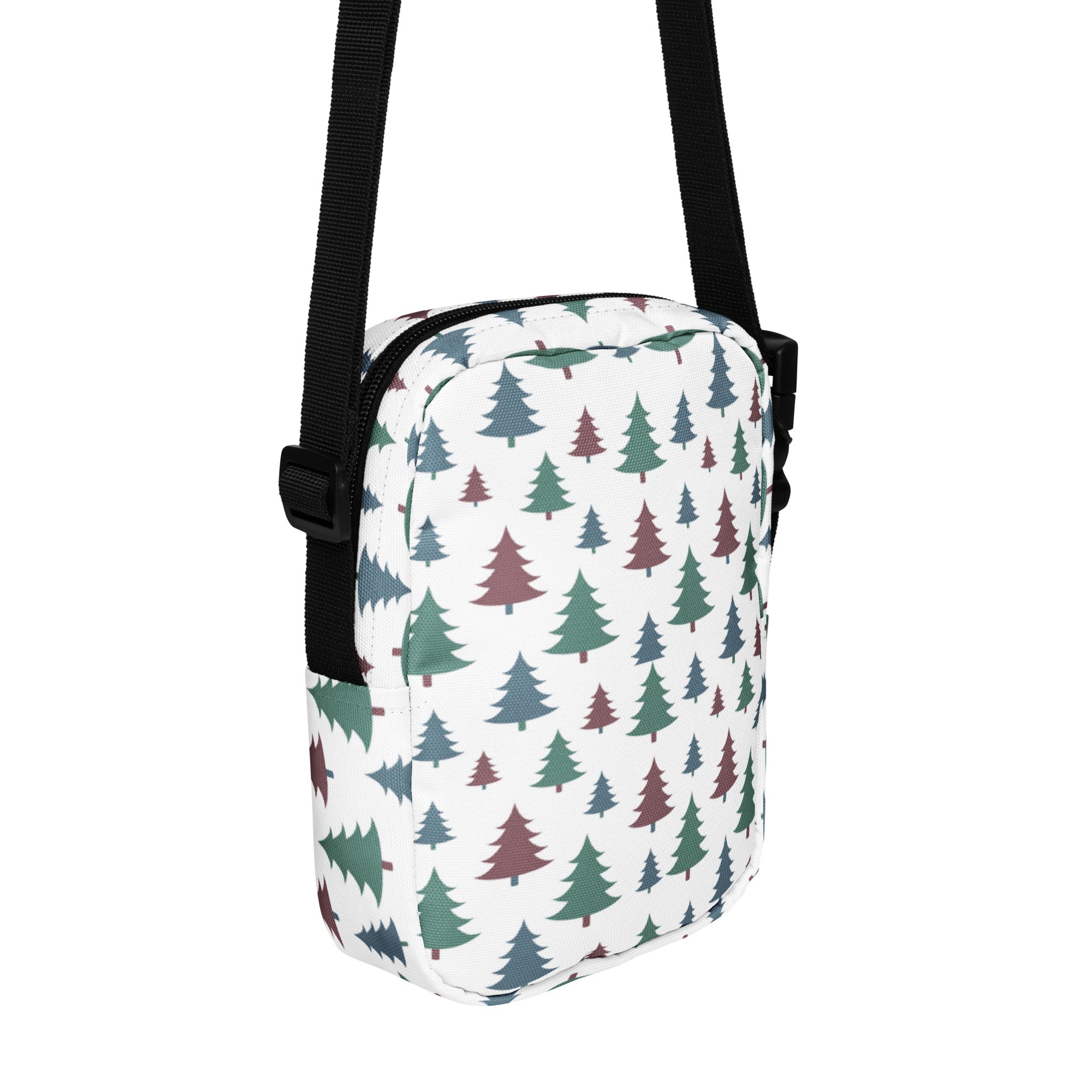 White crossbody bag with green and maroon pine tree pattern and black straps for girls pastel Christmas trees design