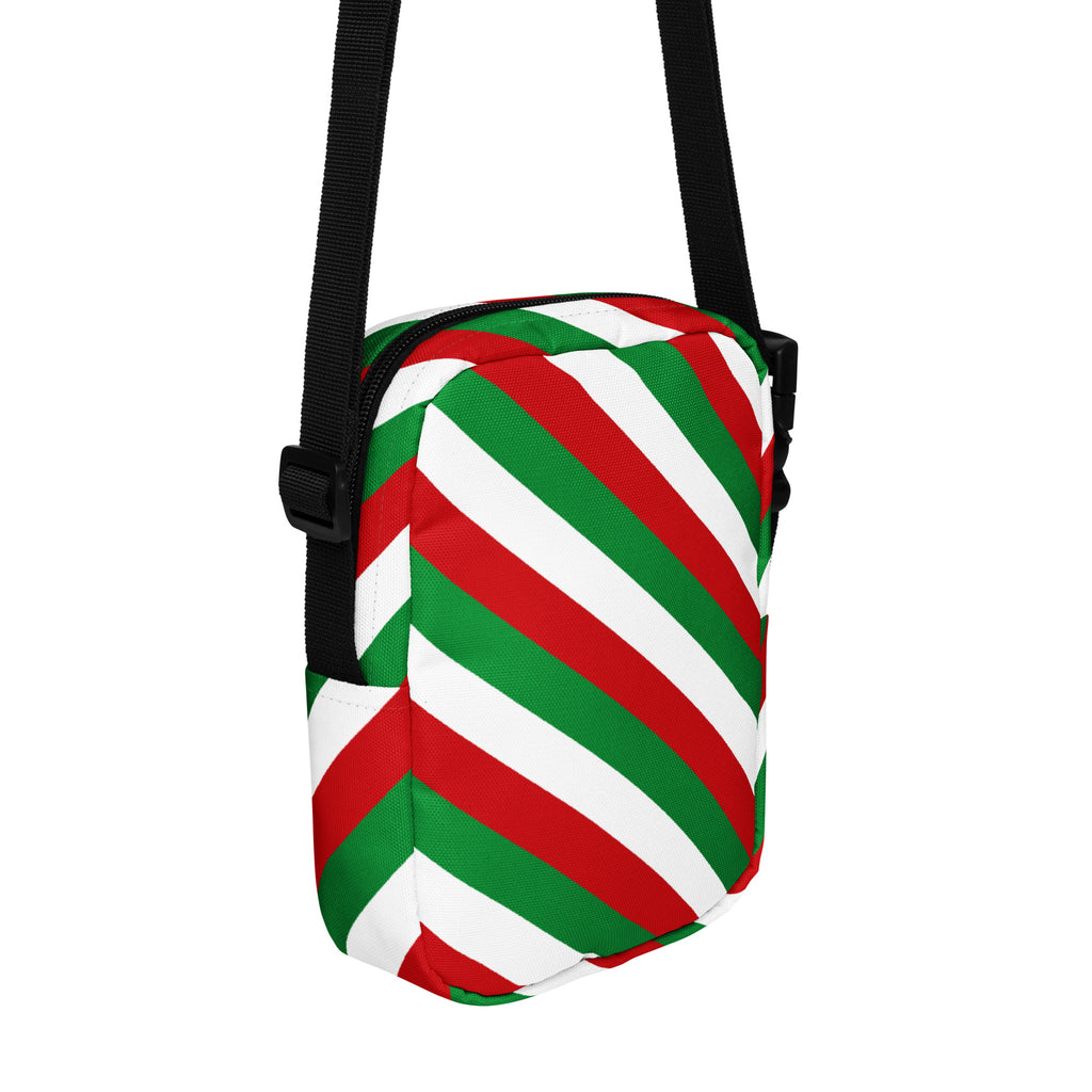 Girls red green and white striped crossbody purse with festive diagonal pattern and black adjustable straps