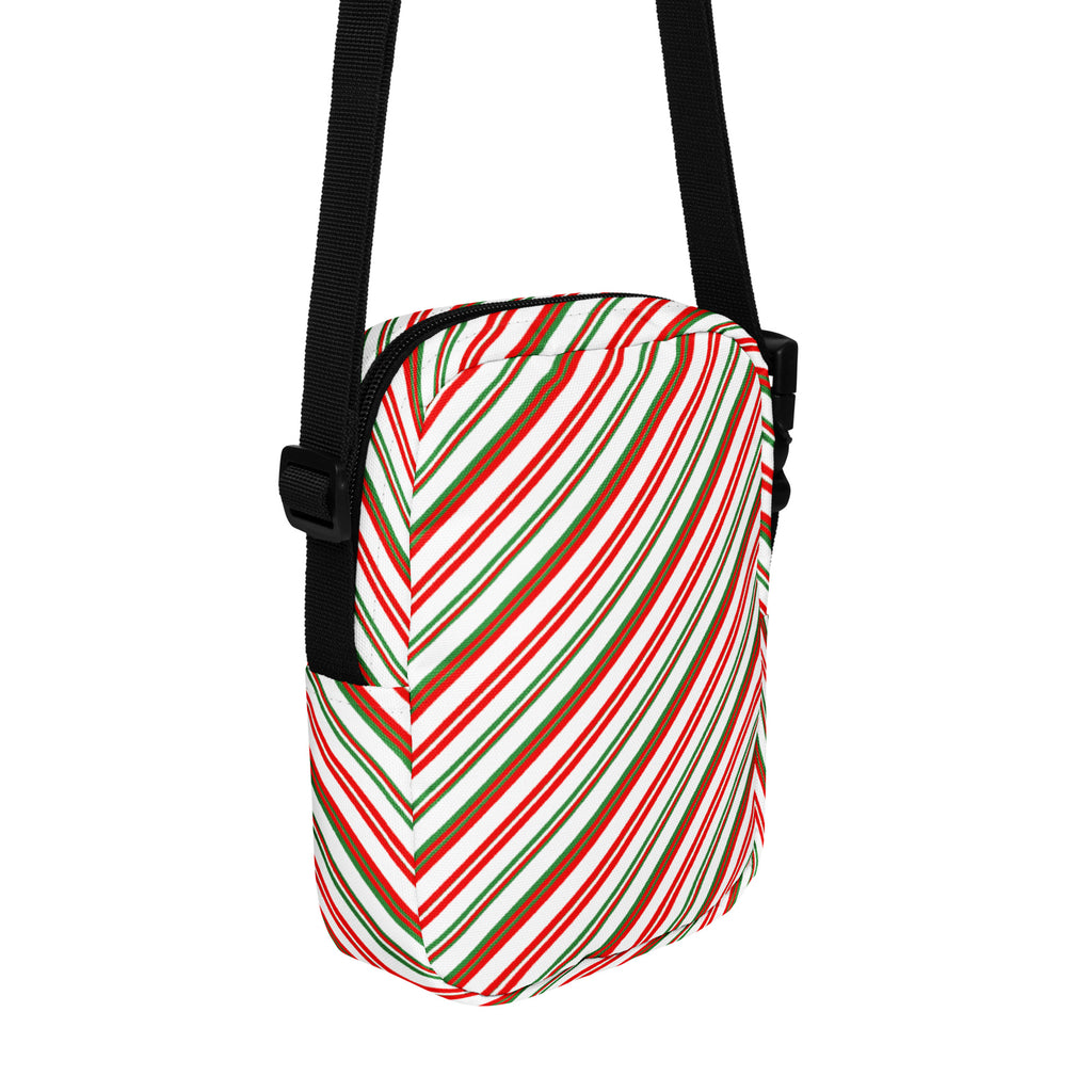 Multicolor diagonal candy stripe christmas women’s crossbody purse with festive red green white fabric and black adjustable strap