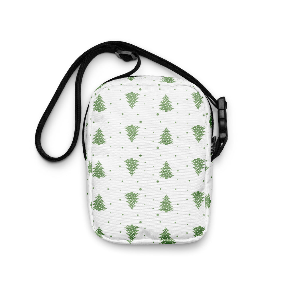 White crossbody bag with green pine tree pattern and black adjustable strap for women’s winter use