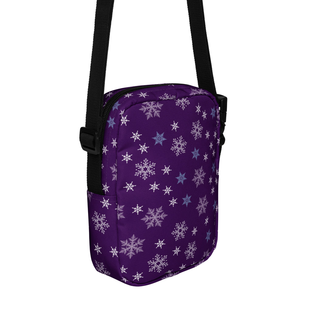 Girls purple snowflakes crossbody purse with white and light blue snowflake pattern and black straps