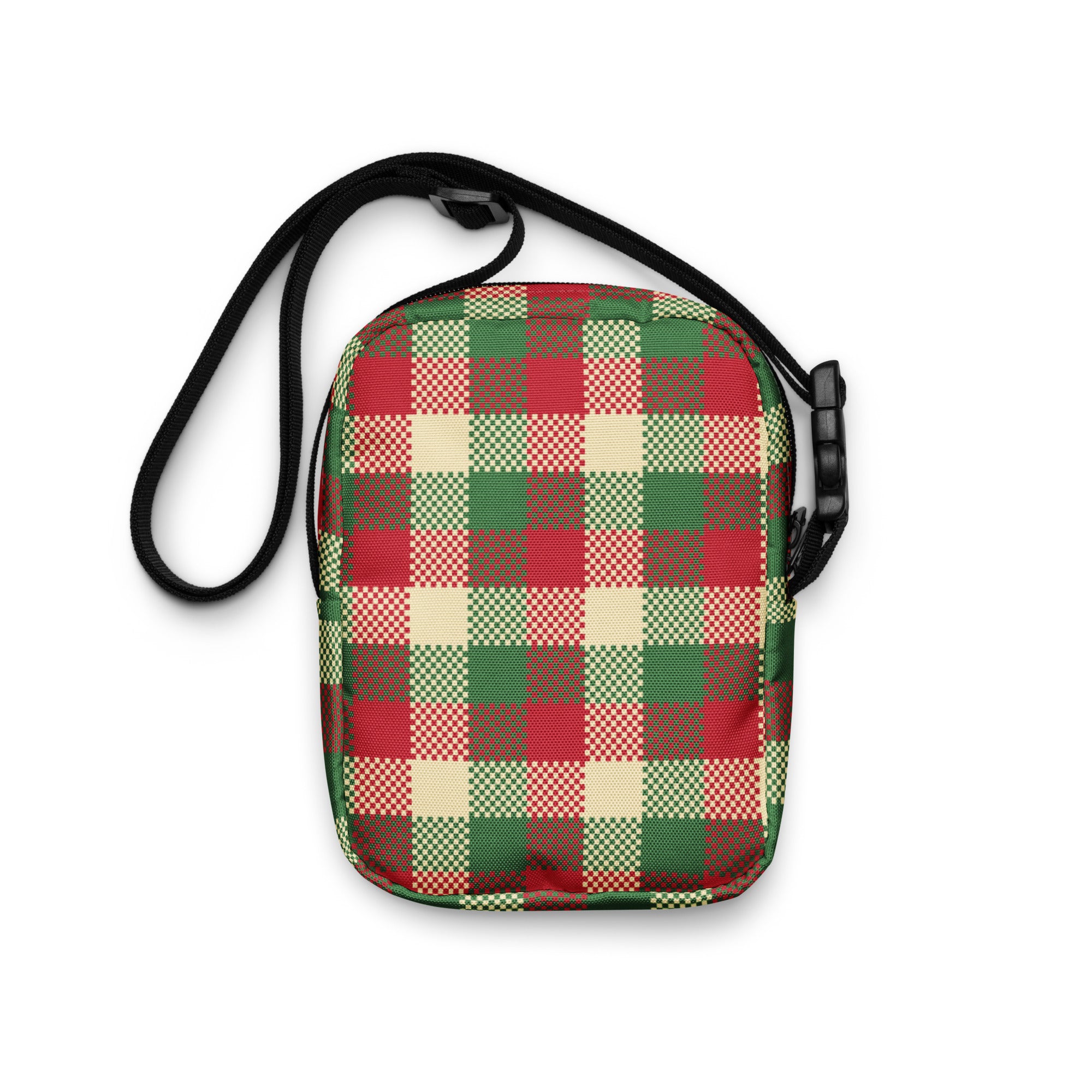 A festive red green and beige plaid winter women’s crossbody purse with a black adjustable strap