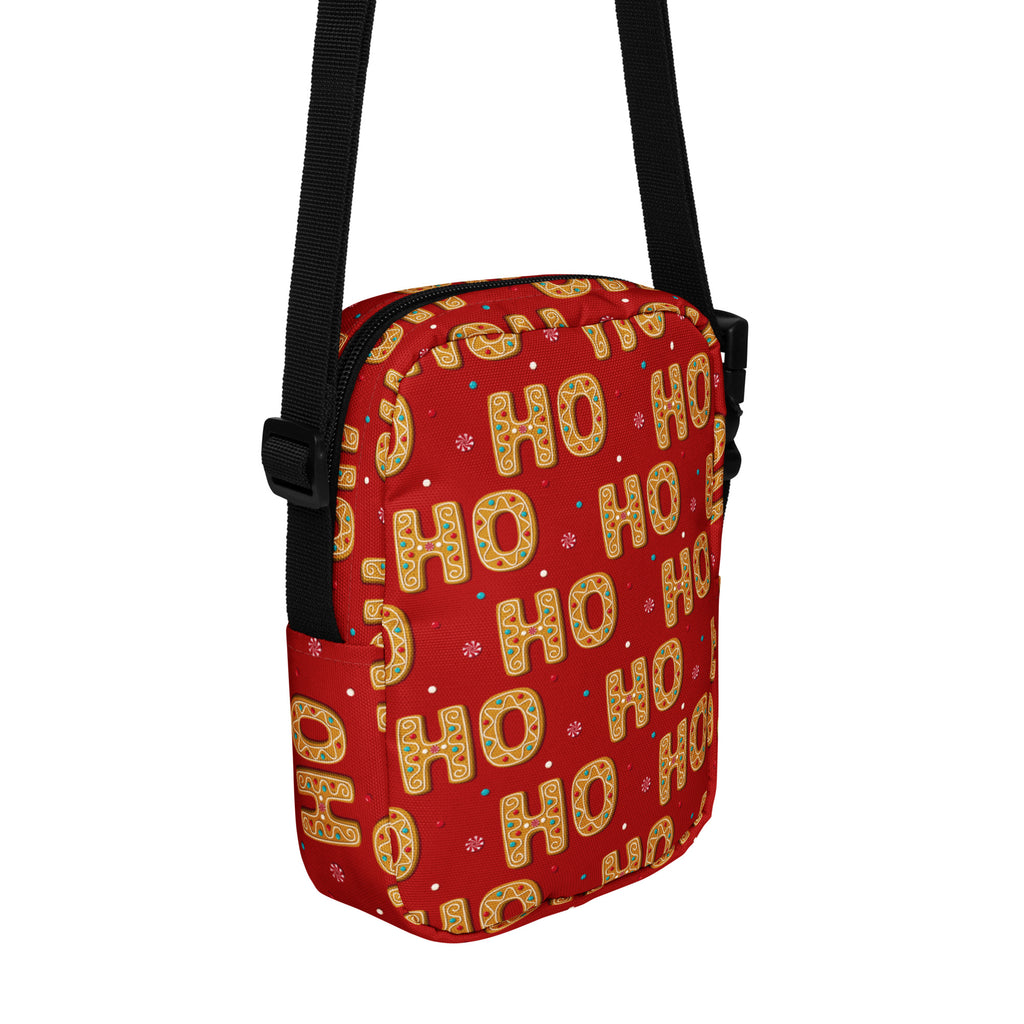 Red ho ho ho christmas women’s crossbody purse with festive gold and green gingerbread pattern and black adjustable straps
