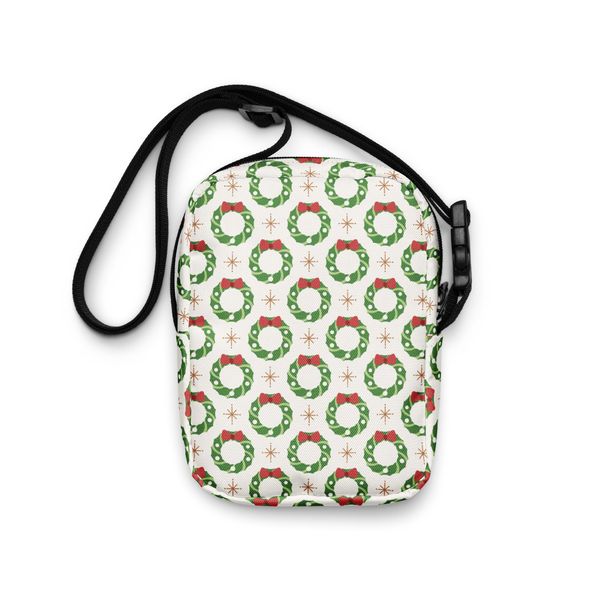 Girls christmas wreath crossbody purse in white with green wreaths red bows and star motifs patterned design