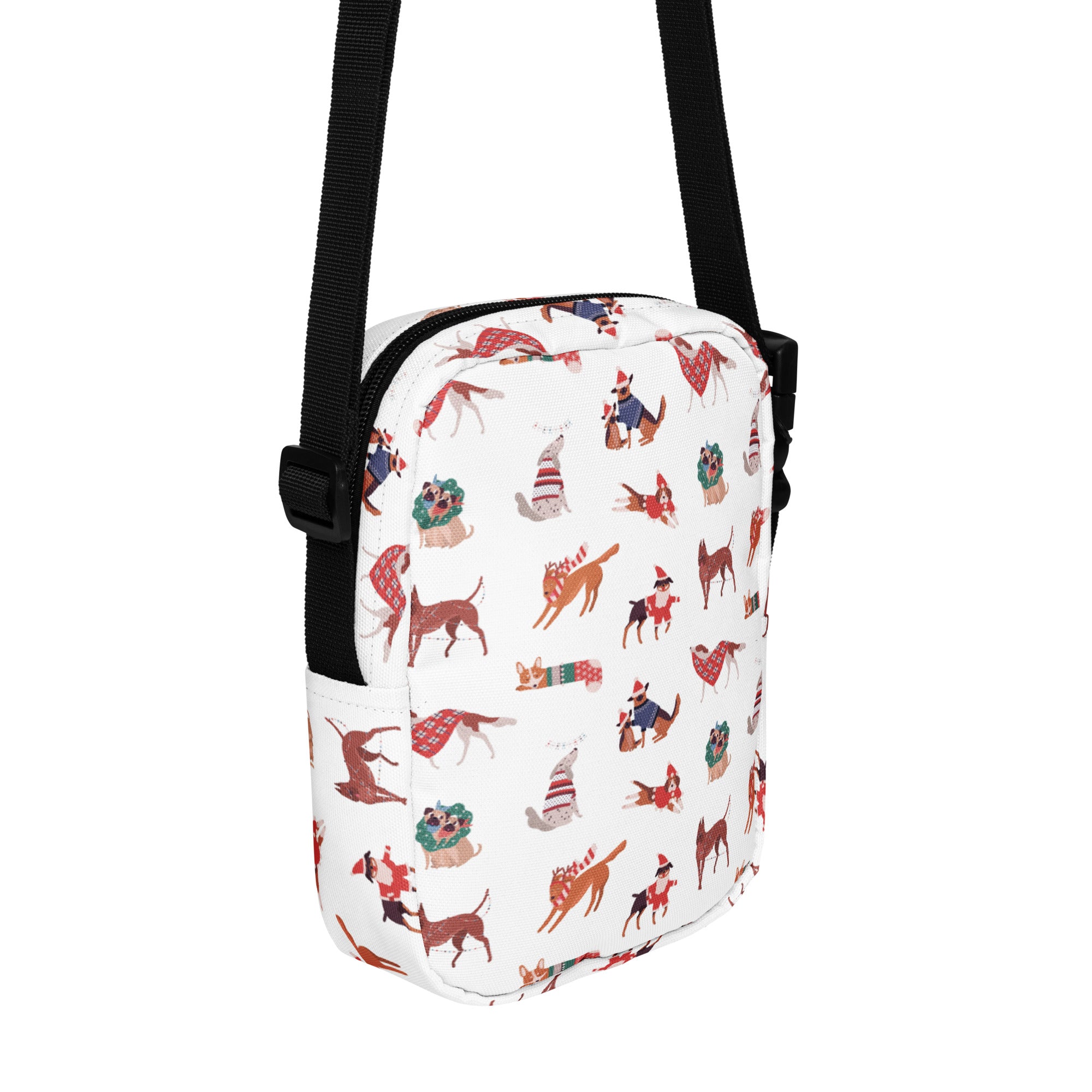 White crossbody bag with festive cartoon dogs in holiday attire and black straps featured in girls christmas dogs purse
