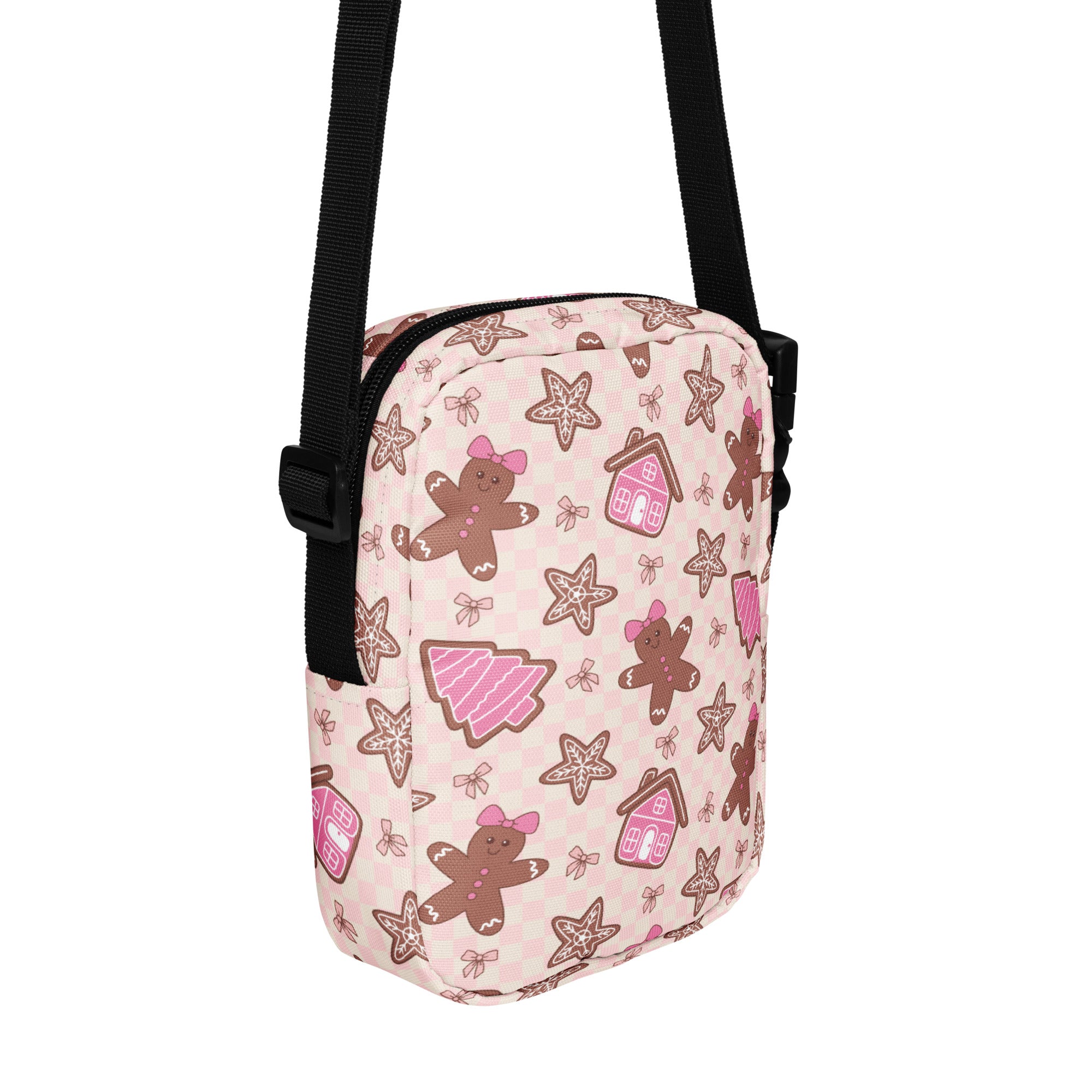 Pink gingerbread christmas women’s crossbody purse with festive gingerbread men and cookie pattern in brown and pink hues