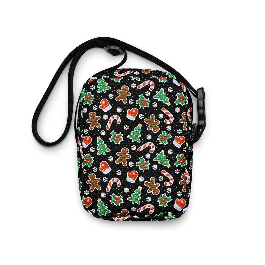 Black girls crossbody bag with festive gingerbread men candy cane christmas tree and mitten pattern