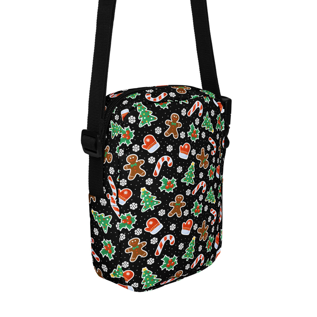 Black girls crossbody bag with festive gingerbread men candy cane christmas tree and mitten pattern in red green and white