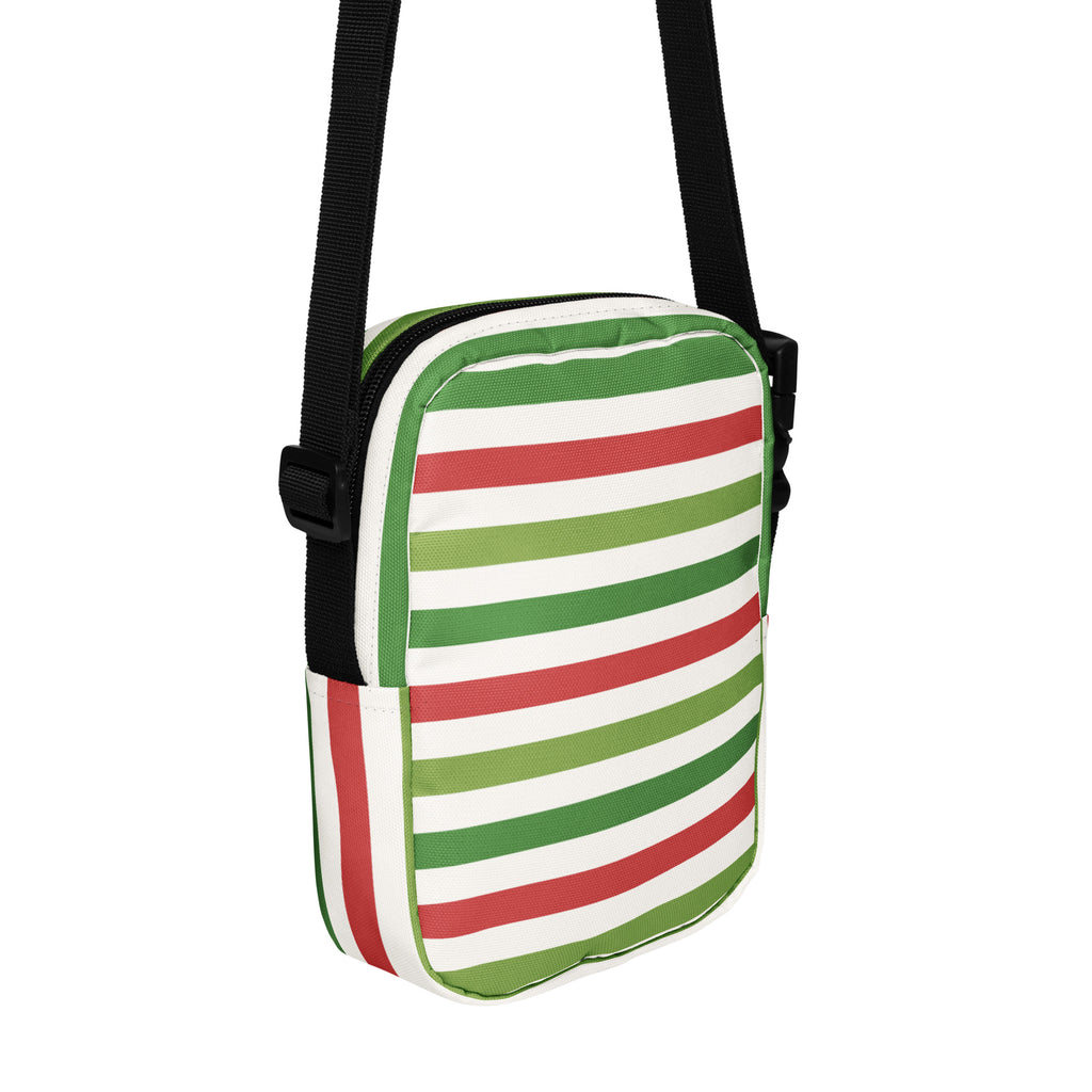 A compact Christmas striped women’s crossbody purse with bold red green and white horizontal stripes