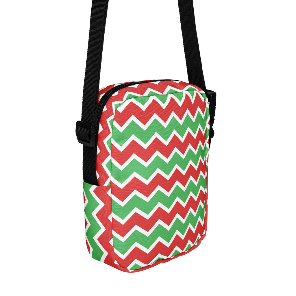Girls red and green chevron crossbody purse with festive pattern and black straps for easy carrying
