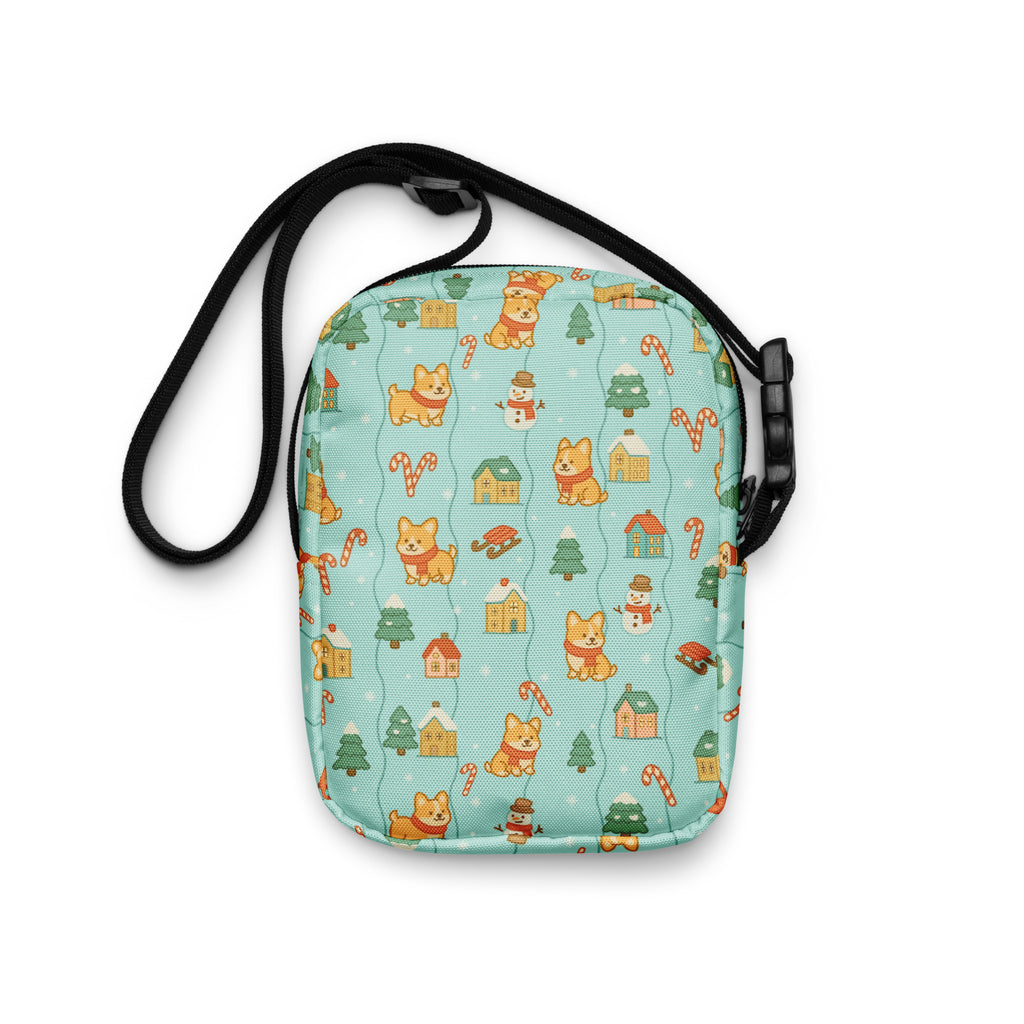 A light blue Shiba Inu Christmas crossbody purse with festive corgi snowmen candy cane and house pattern