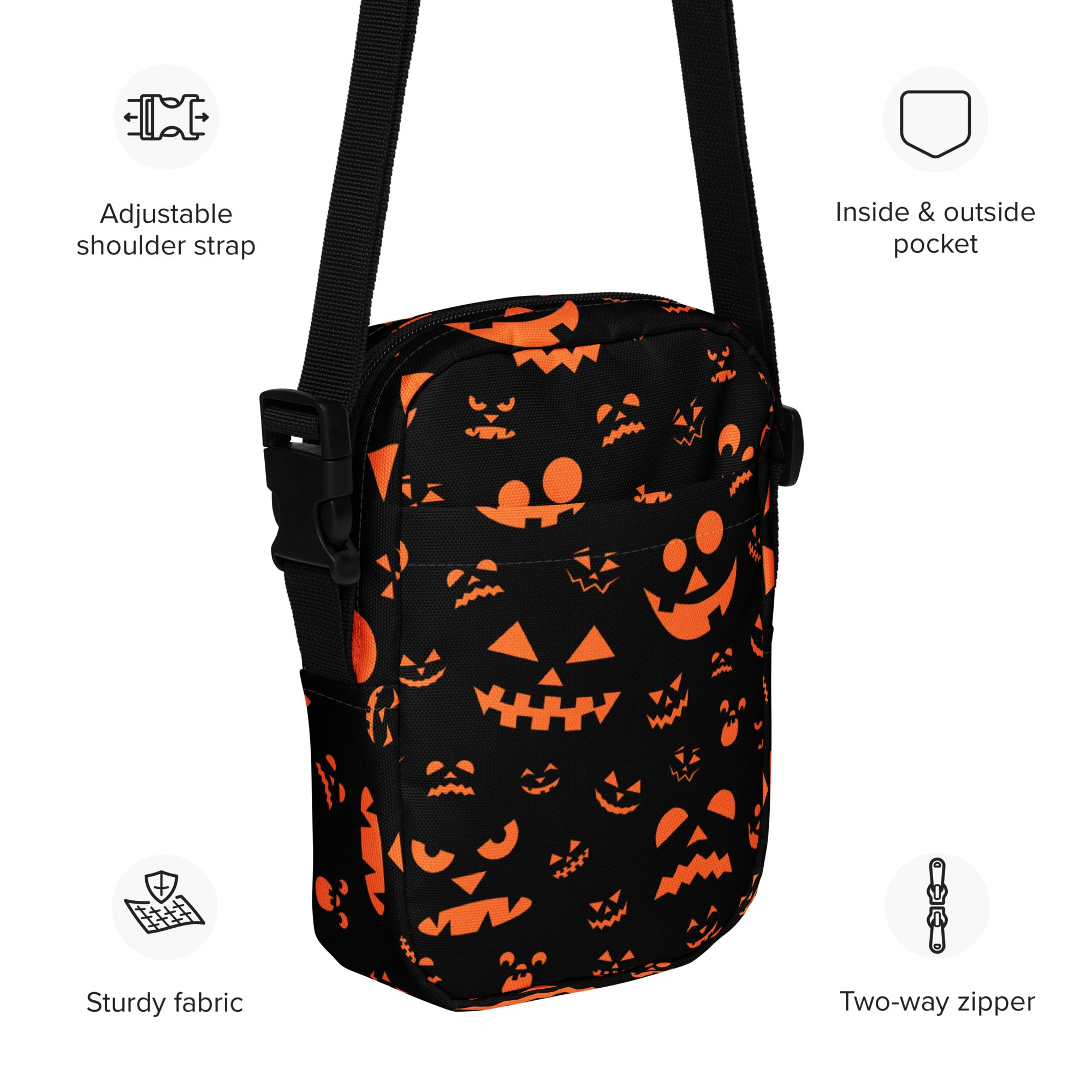 Black crossbody bag with orange jack o lantern face pattern and adjustable shoulder strap for girls halloween use