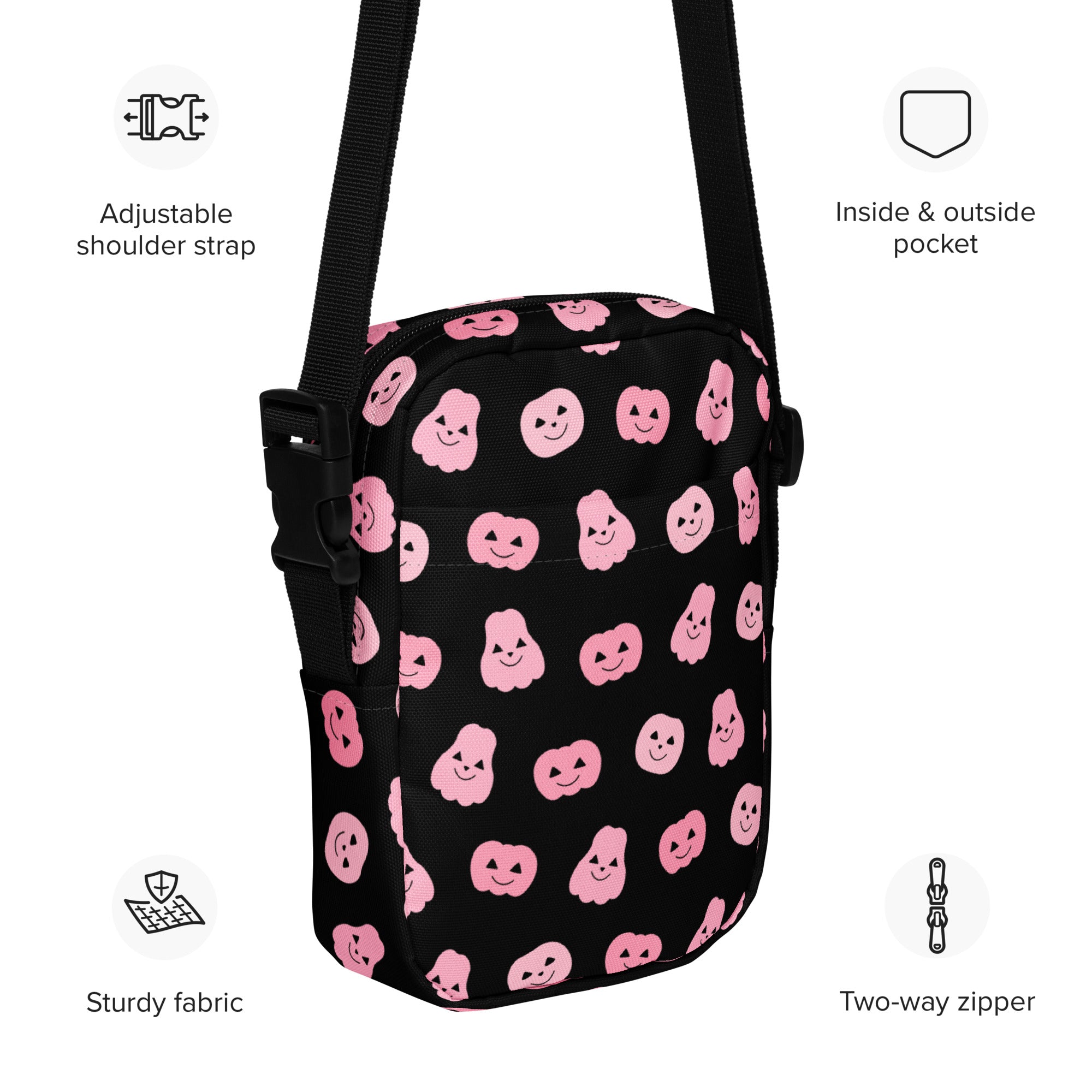 Black girls crossbody bag with pink smiling ghost and pumpkin patterns on sturdy fabric for Halloween use