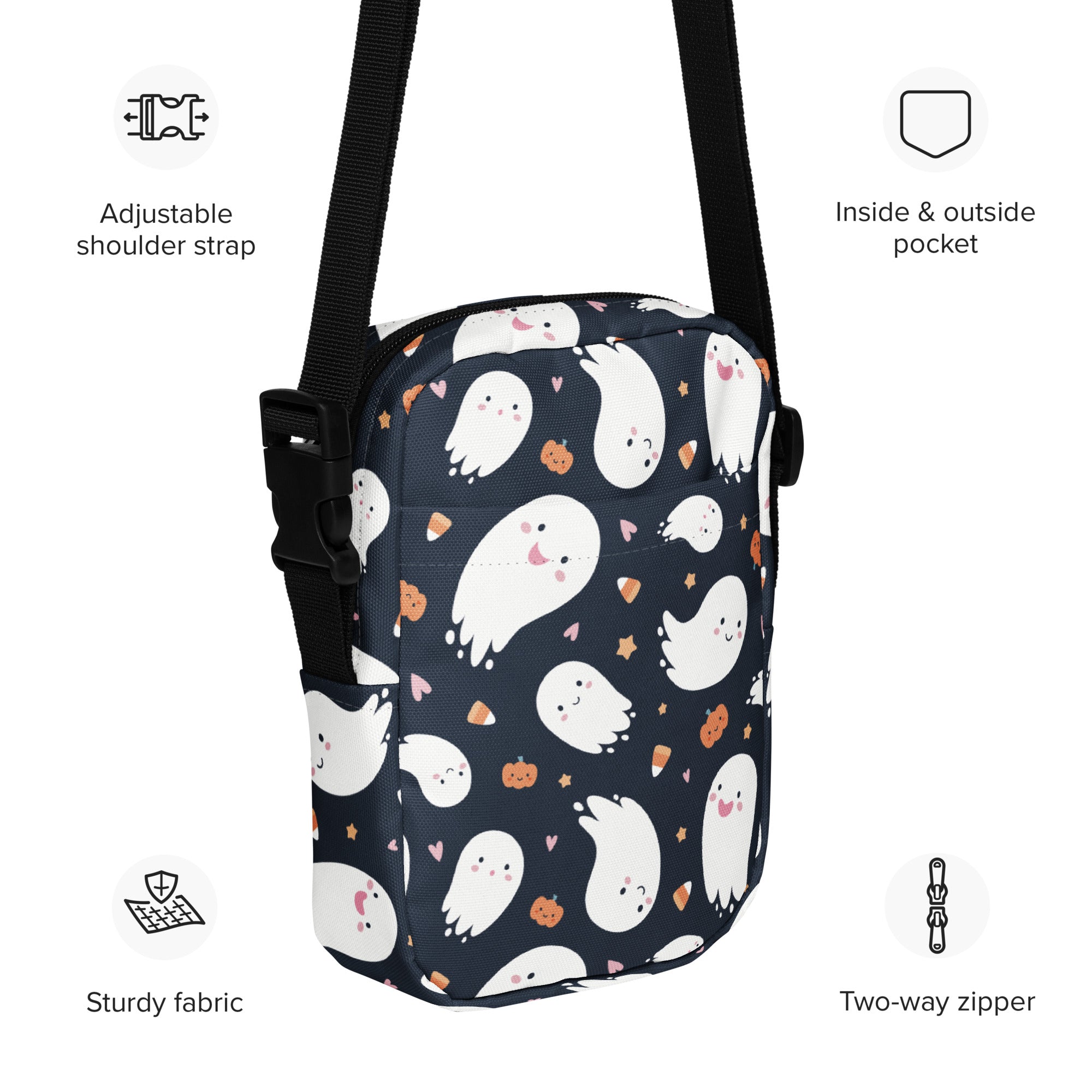 A navy blue kids ghost halloween crossbody purse with white cartoon ghosts and orange pumpkins pattern
