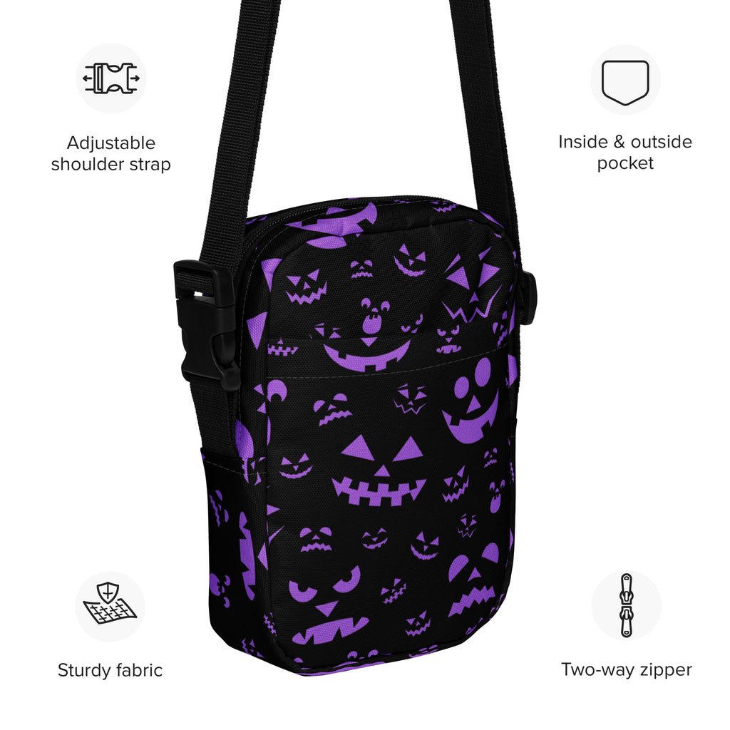 Girls purple jack-o-lantern faces halloween crossbody purse with black adjustable strap and pumpkin pattern