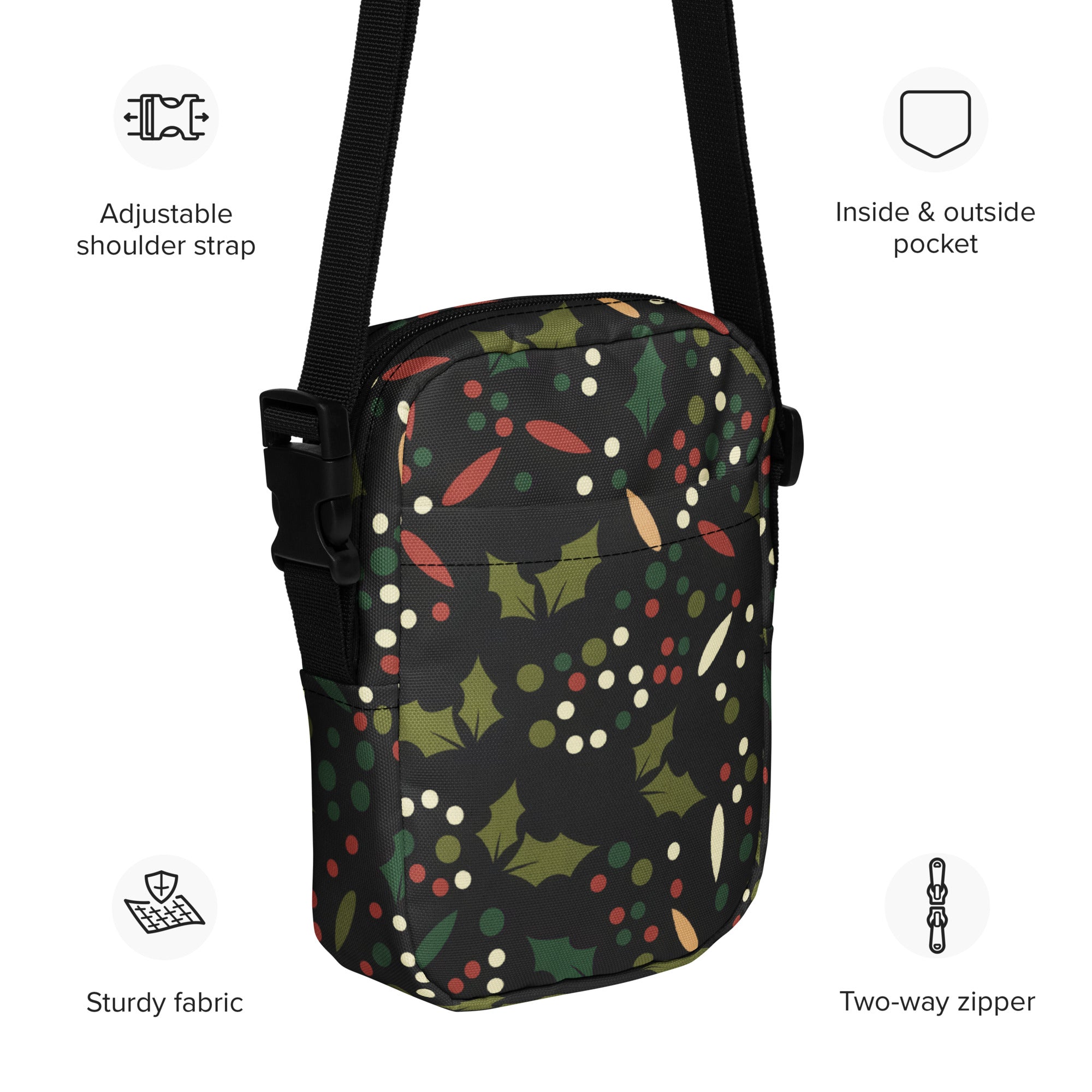 Black crossbody bag with festive red christmas holly and berries pattern on sturdy fabric for women